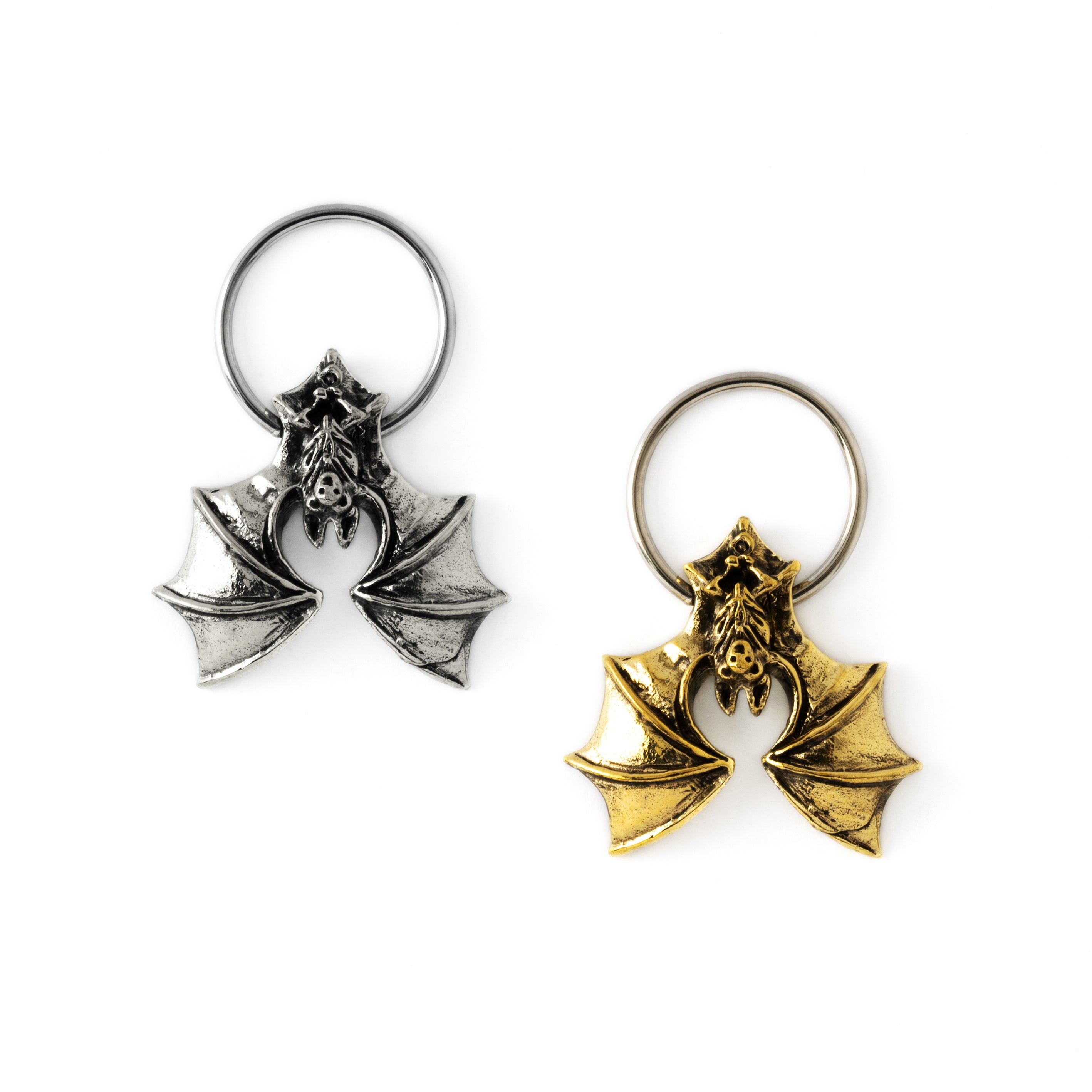 silver and golden colour surgical steel finely detailed bat piercing rings frontal view