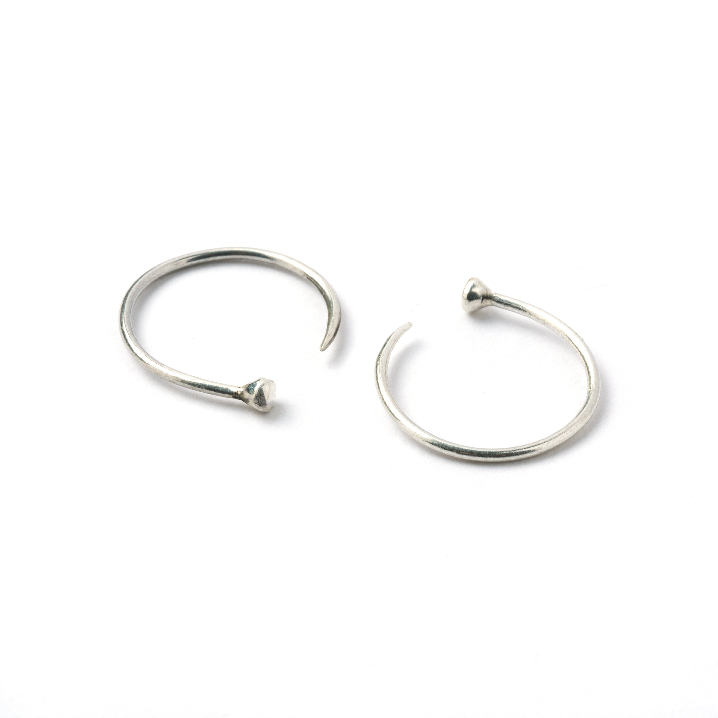 pair of open hoop silver wire earrings side and front view