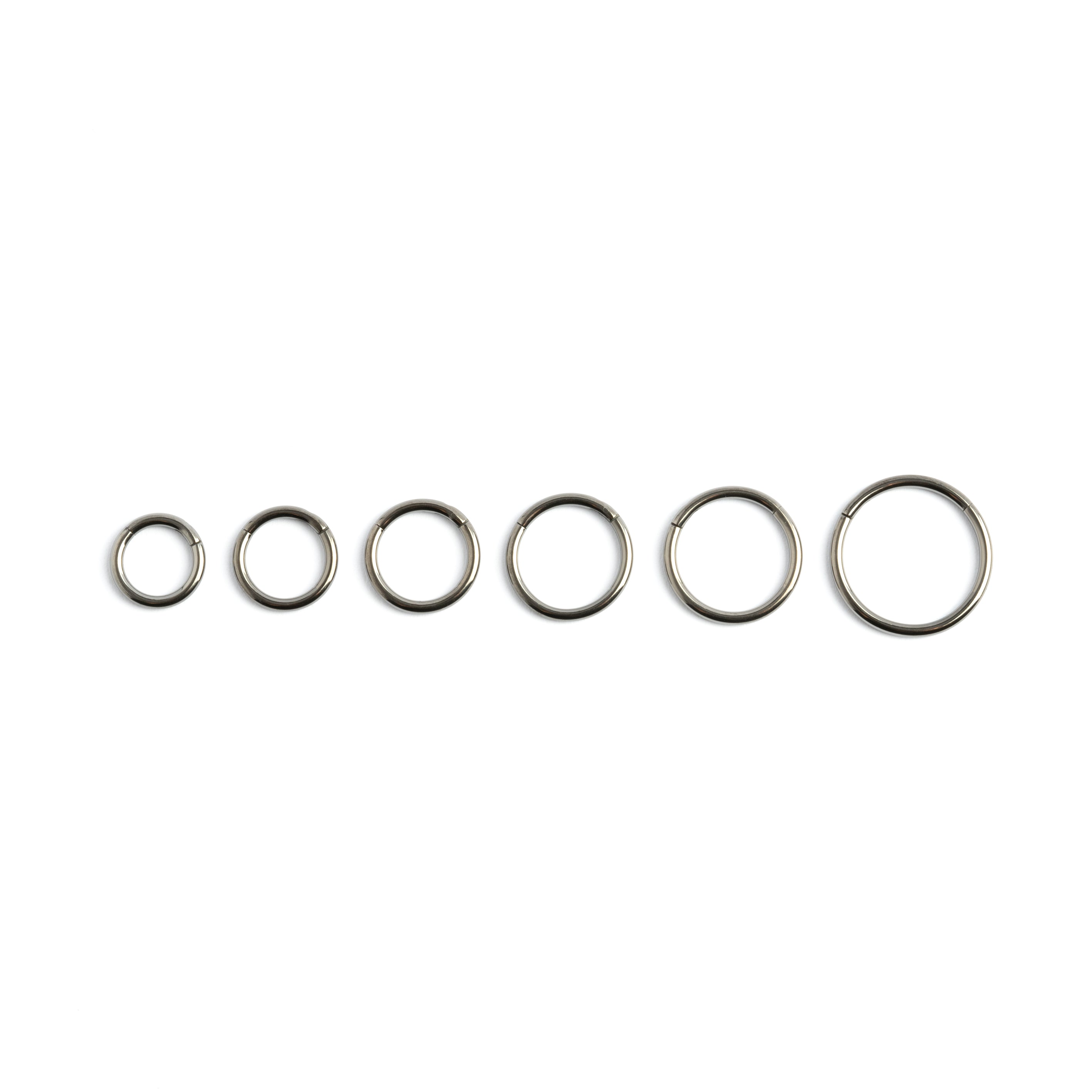 all sizes dark steel clicker piercing rings frontal view