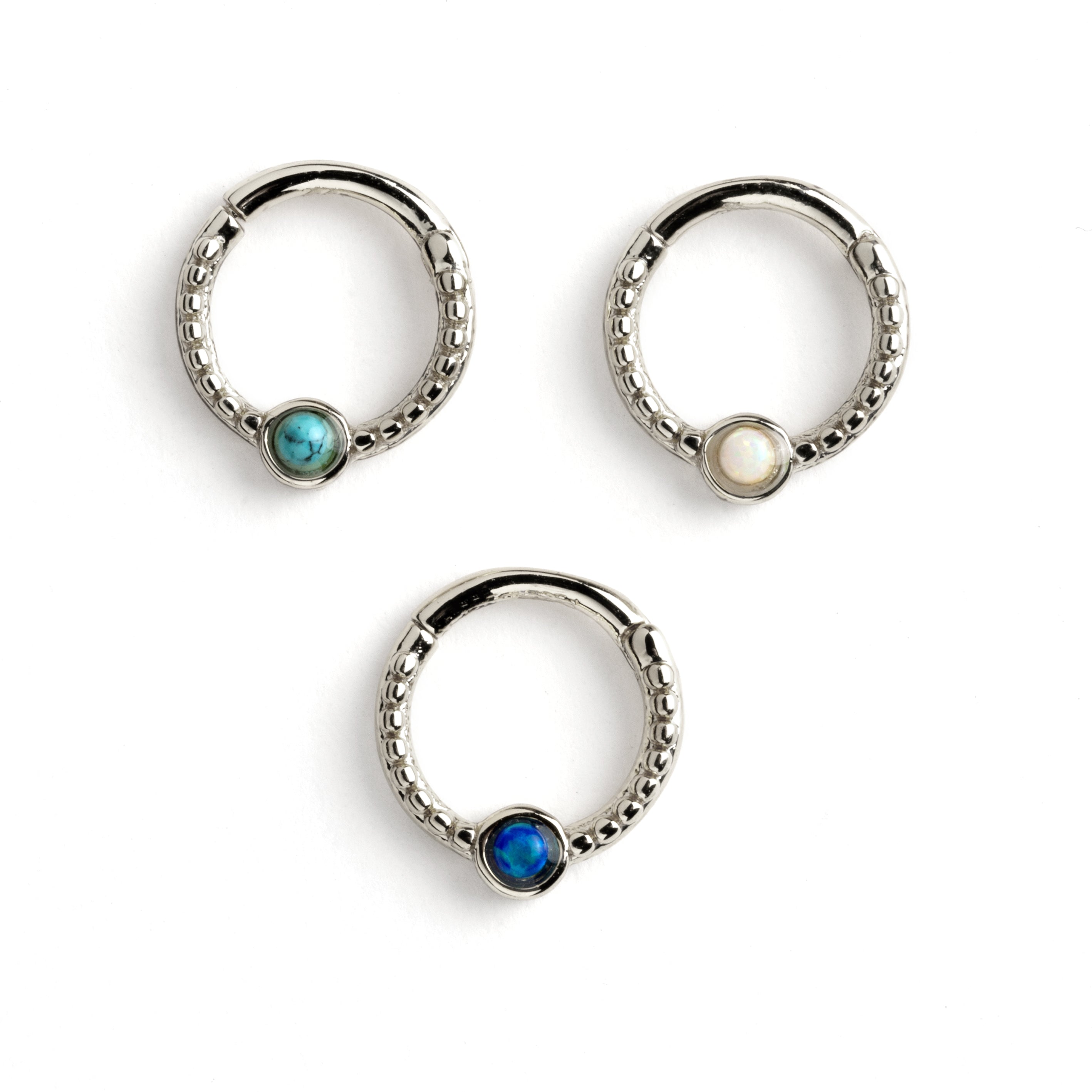 Dayaa surgical steel septum clicker with blue opai, white opal and turquoise frontal view