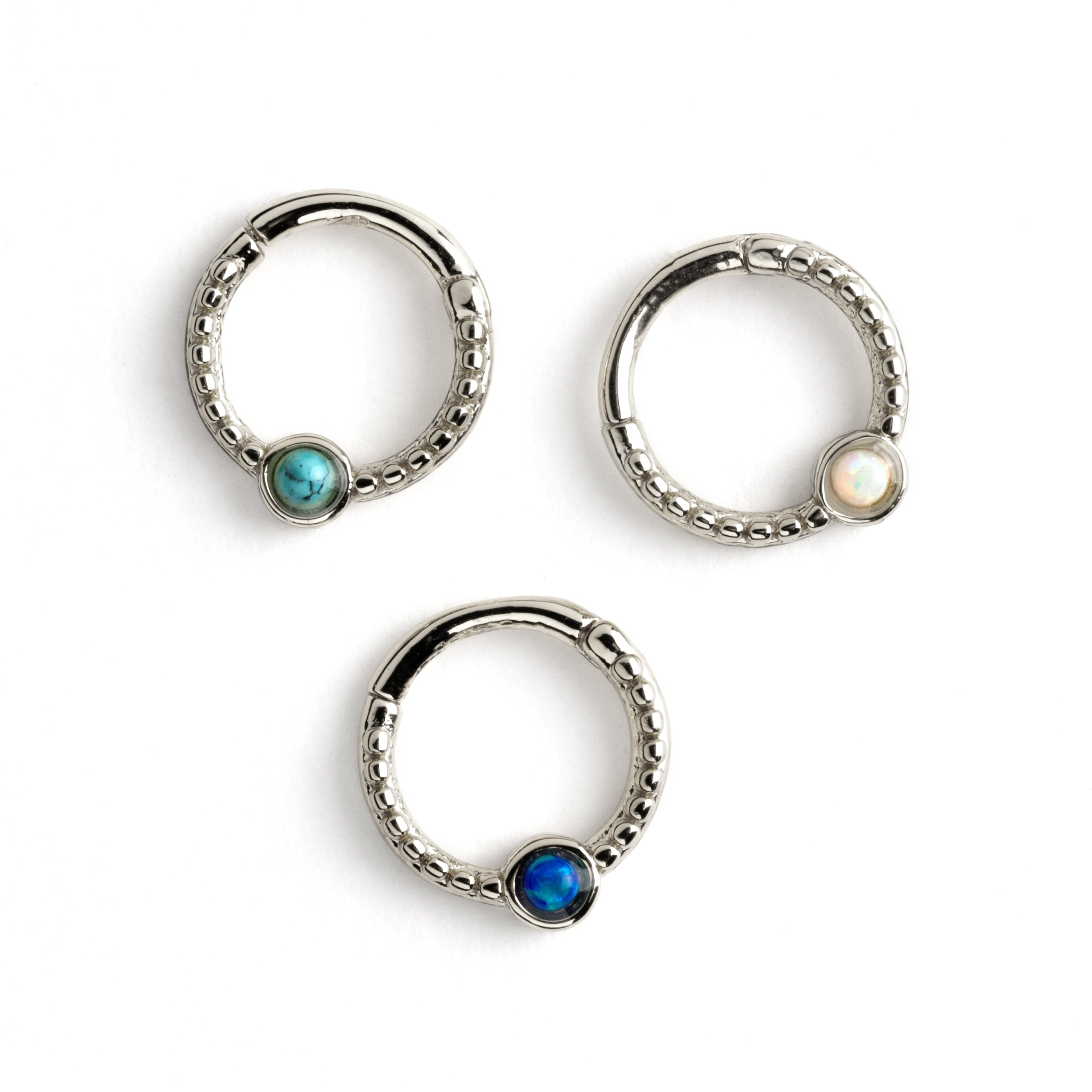 Dayaa surgical steel septum clicker with blue opal, white opal and turquoise frontal view