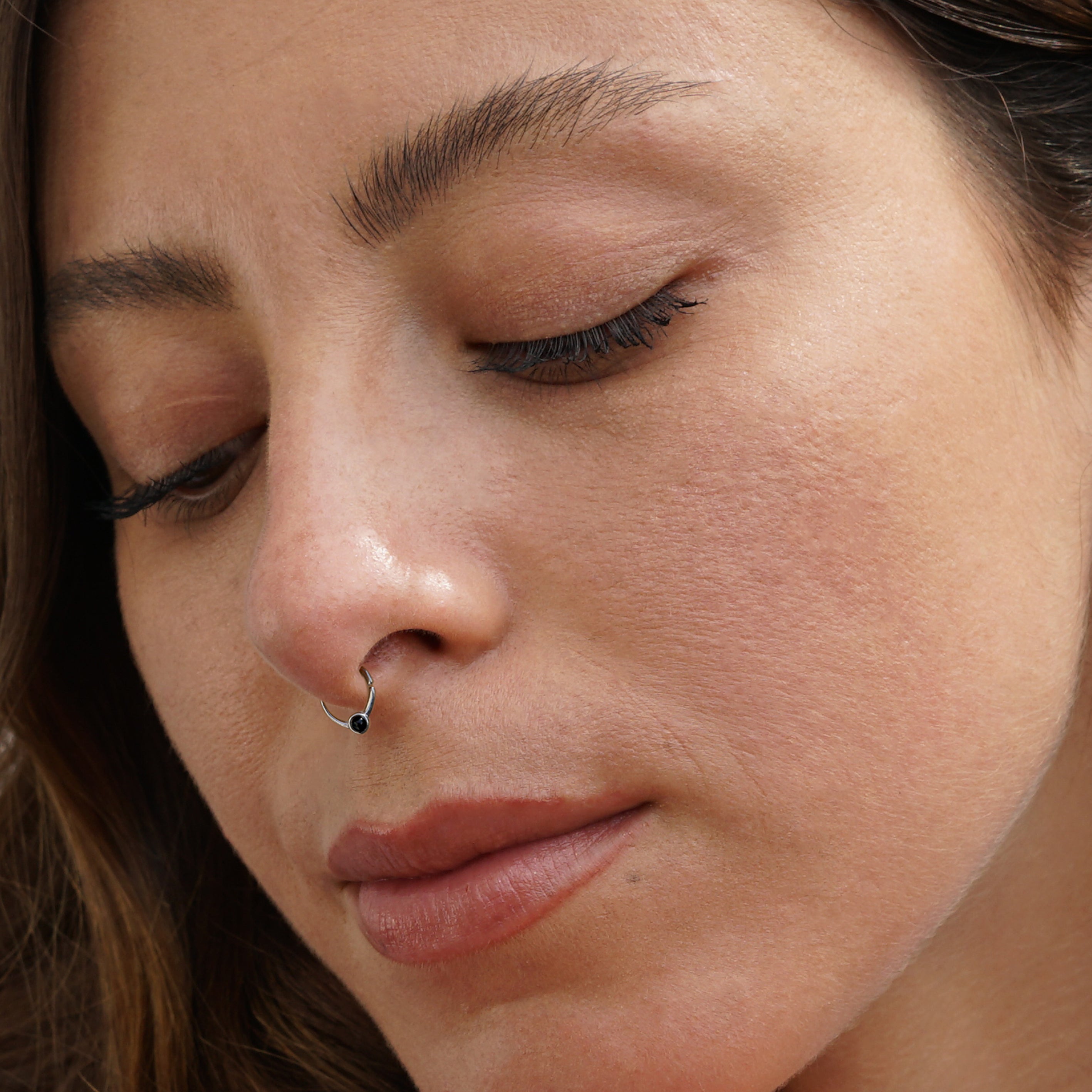 model wearing Devika Silver Septum with Black Onyx