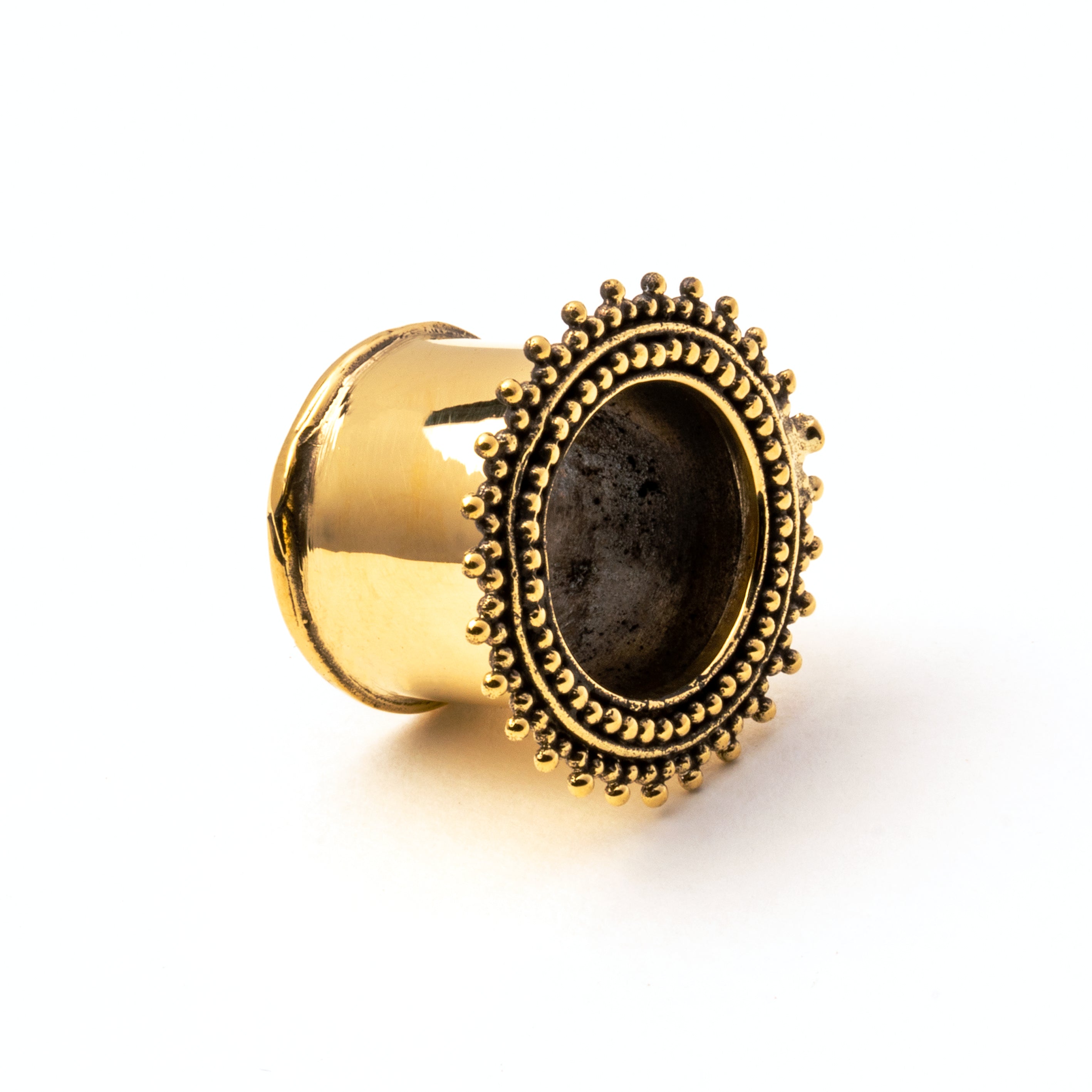 single golden brass Indian ear tunnel right front view