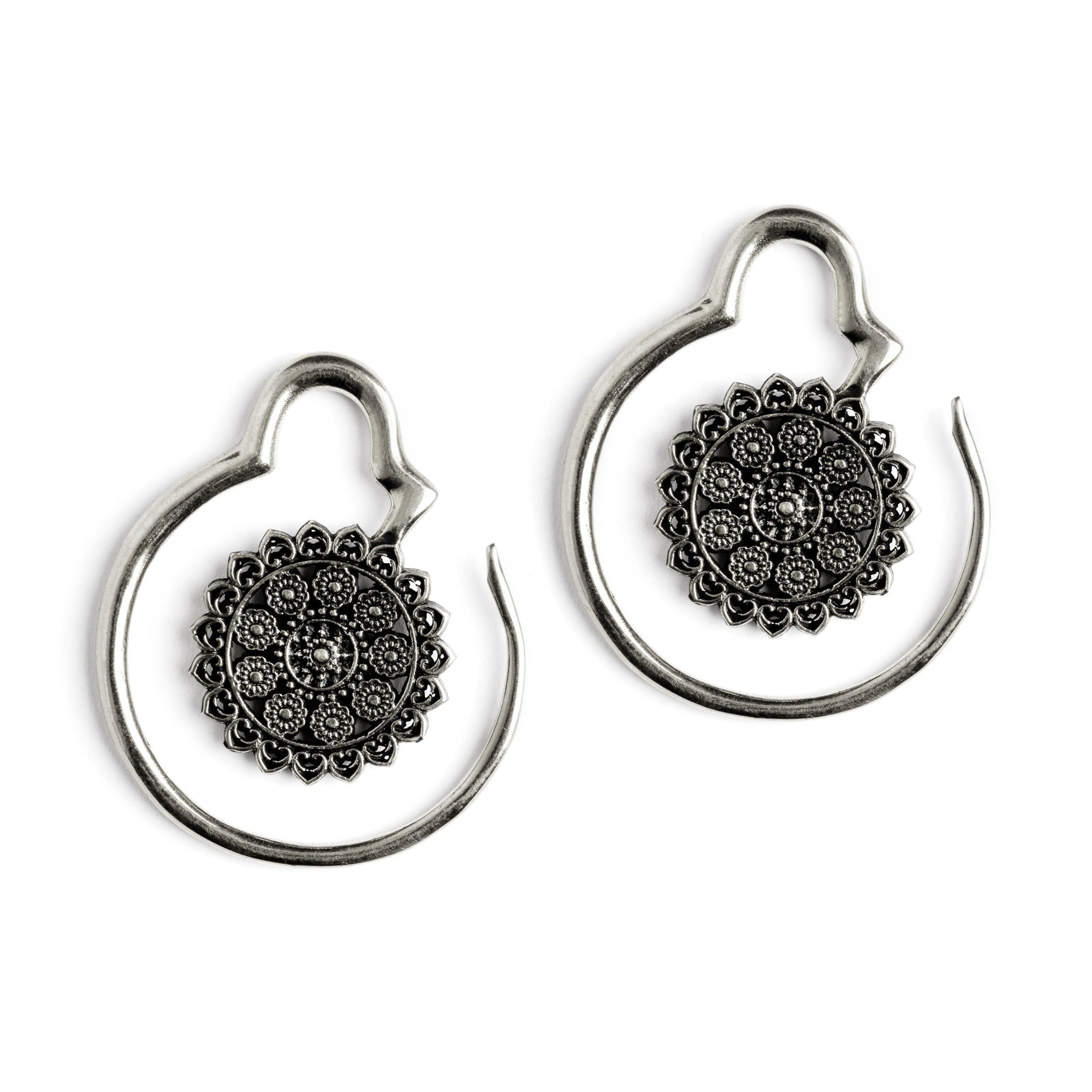 pair of silver brass hook ear hangers with intricate floral filigree frontal view