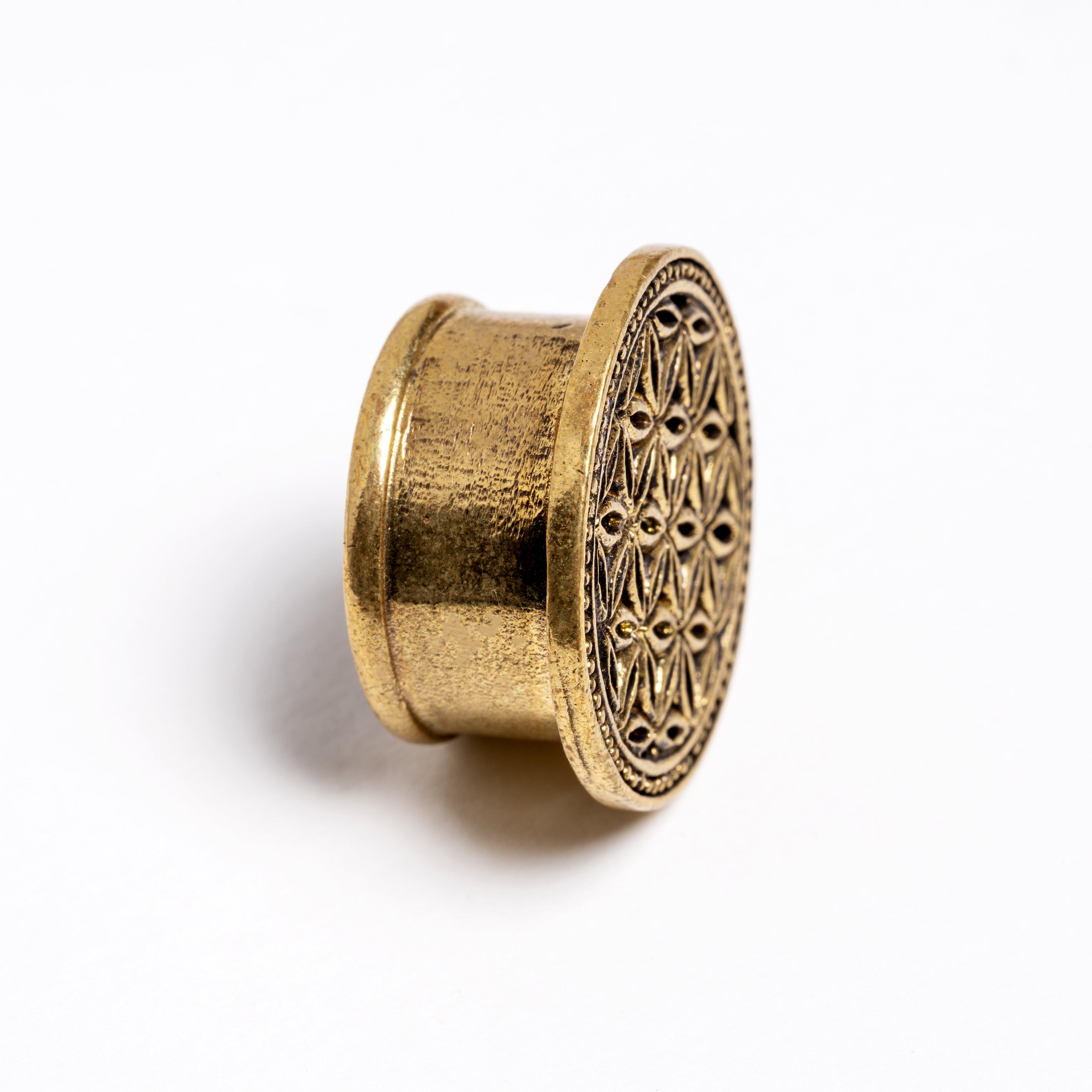 Flower of Life brass flesh tunnel side view