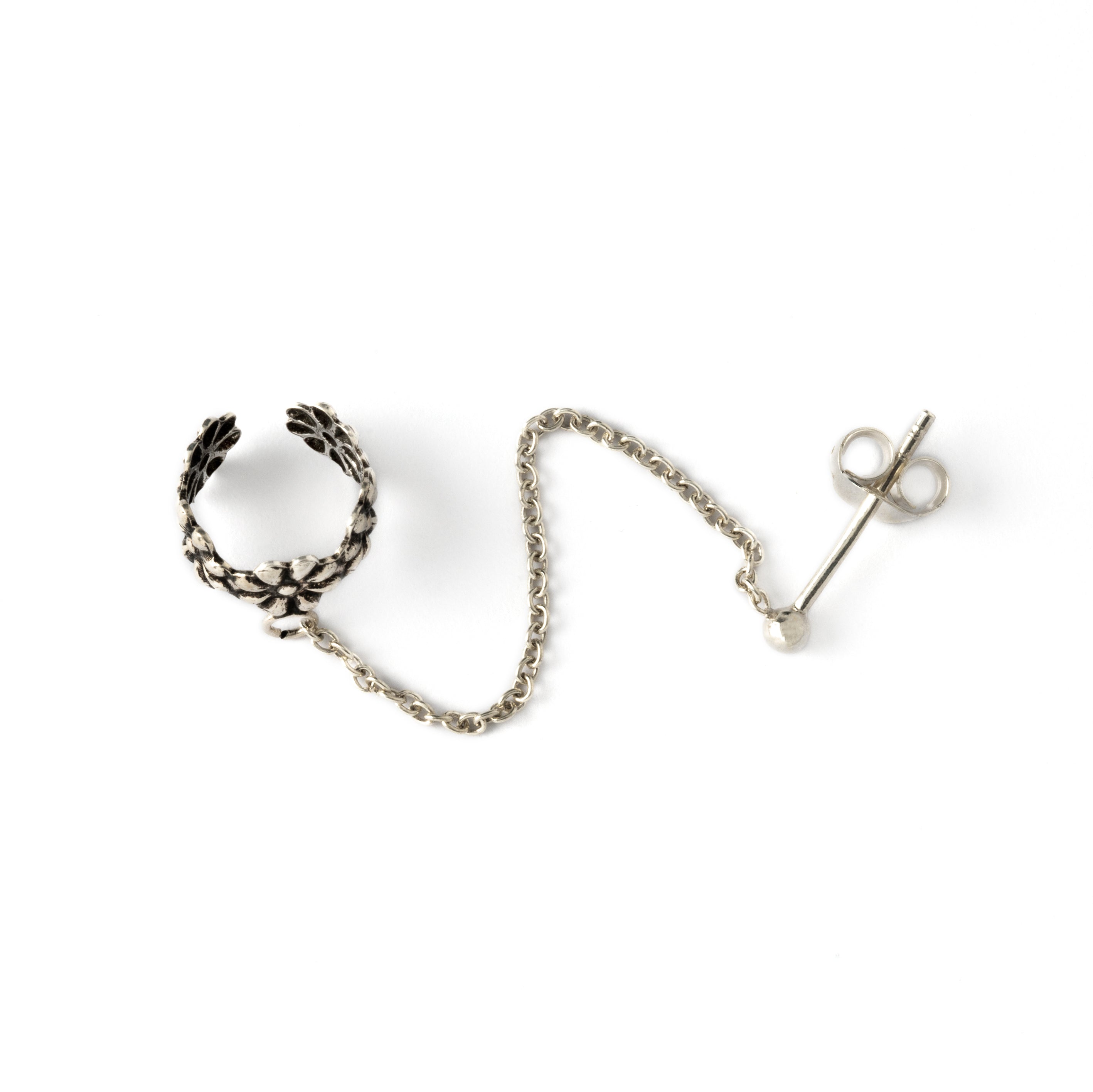 floral silver ear cuff chained to a stud earring above view