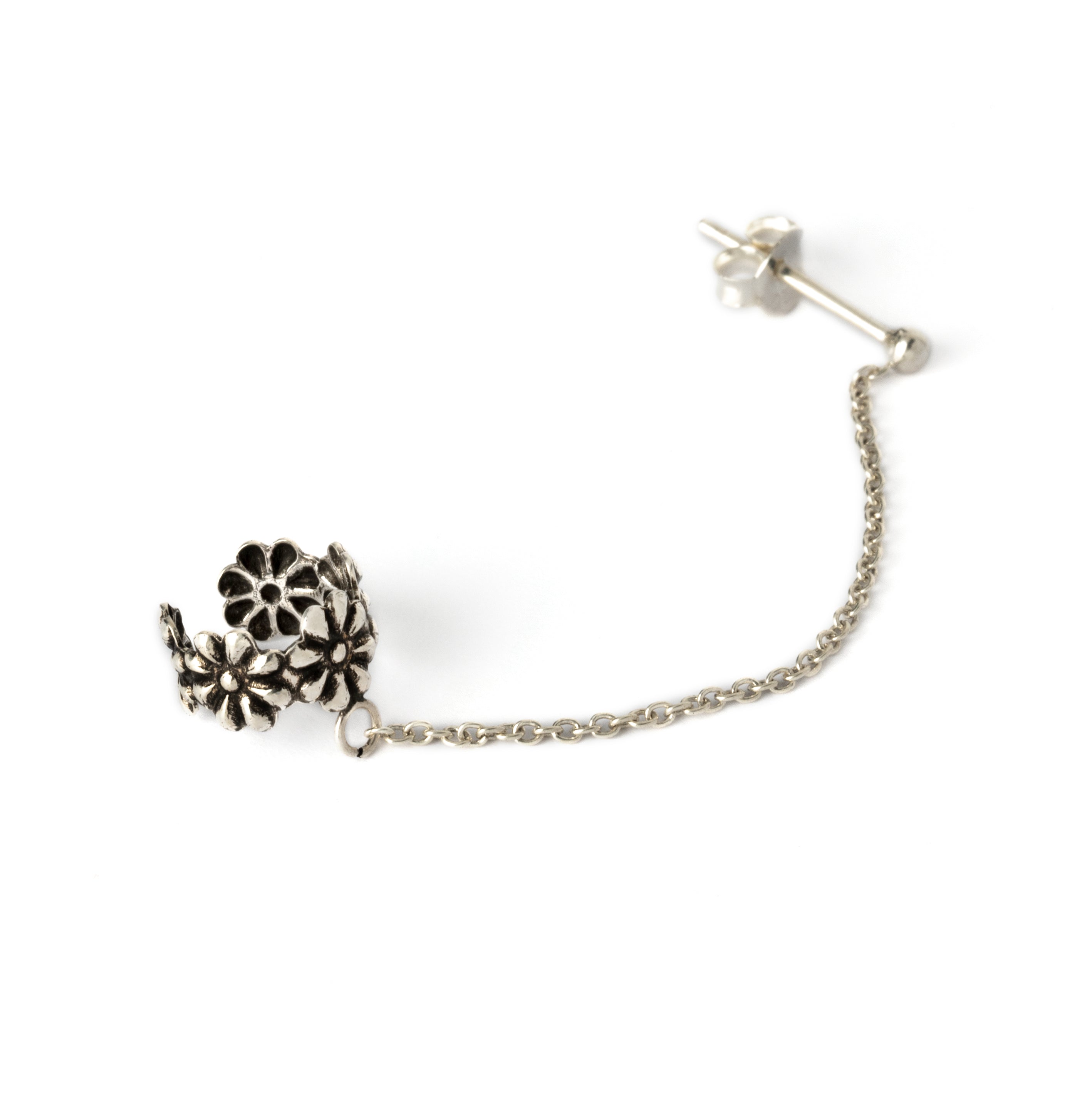 floral silver ear cuff chained to a stud earring side view