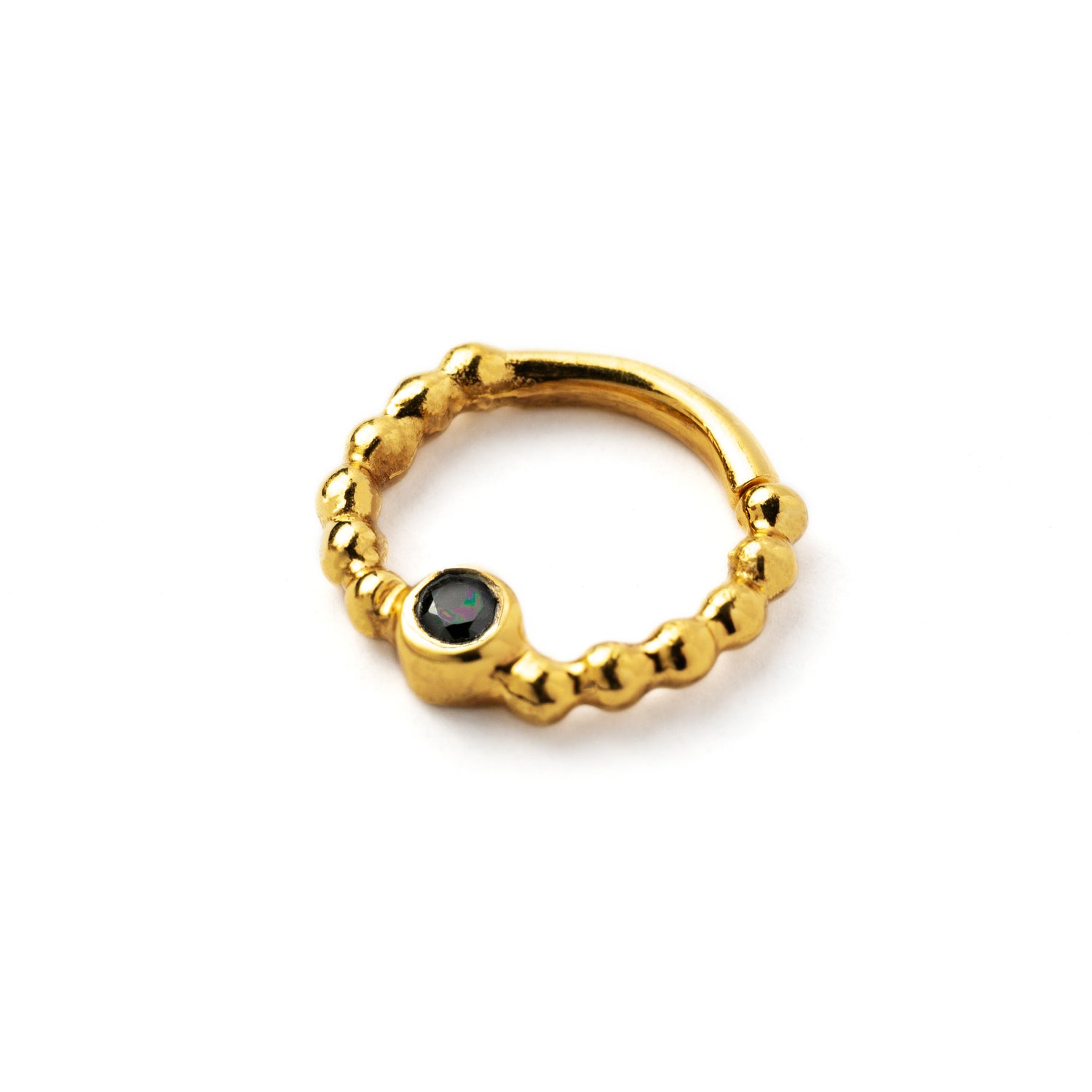 gold dotted septum ring with Black Spinal gemstone left side view