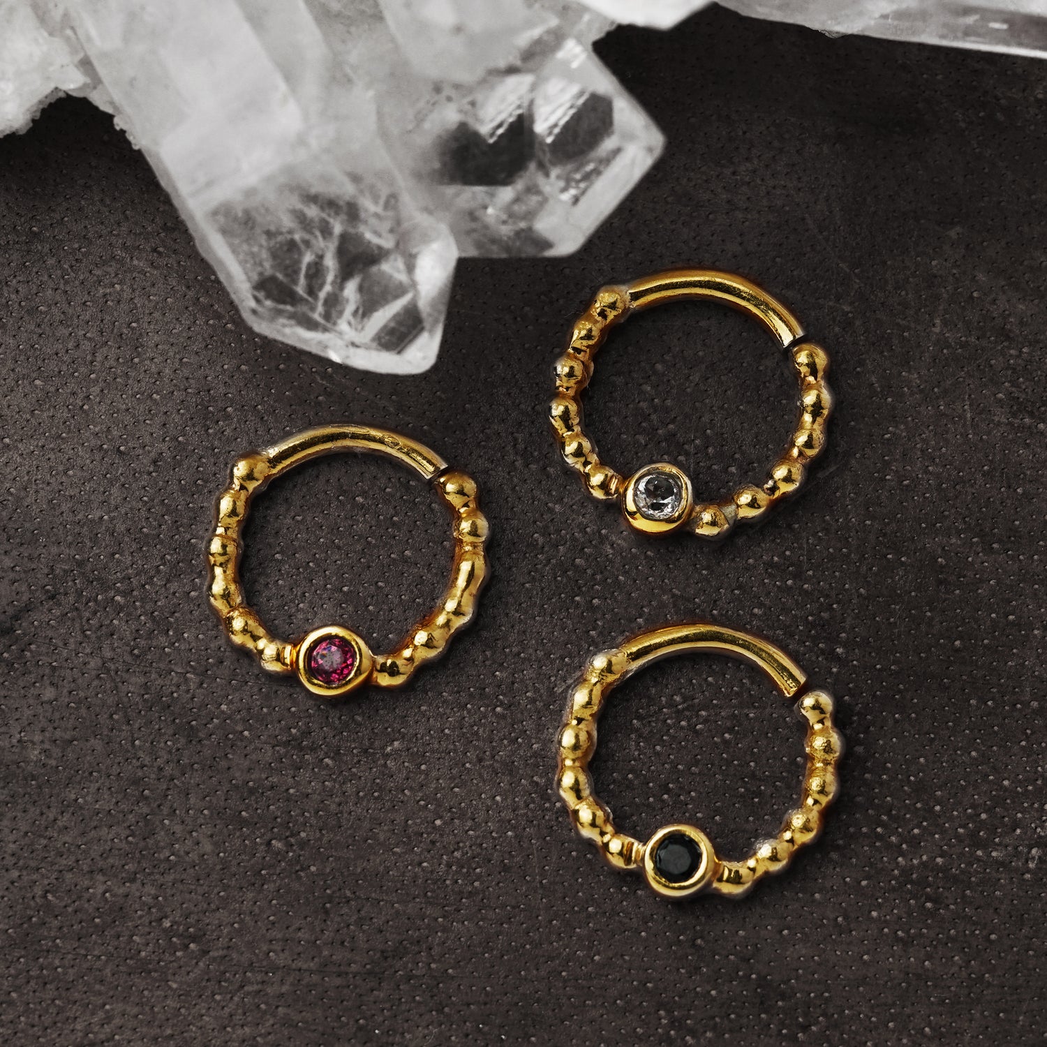 gold dotted septum ring with Black Spinal, Ruby & Topaz gemstones right side view