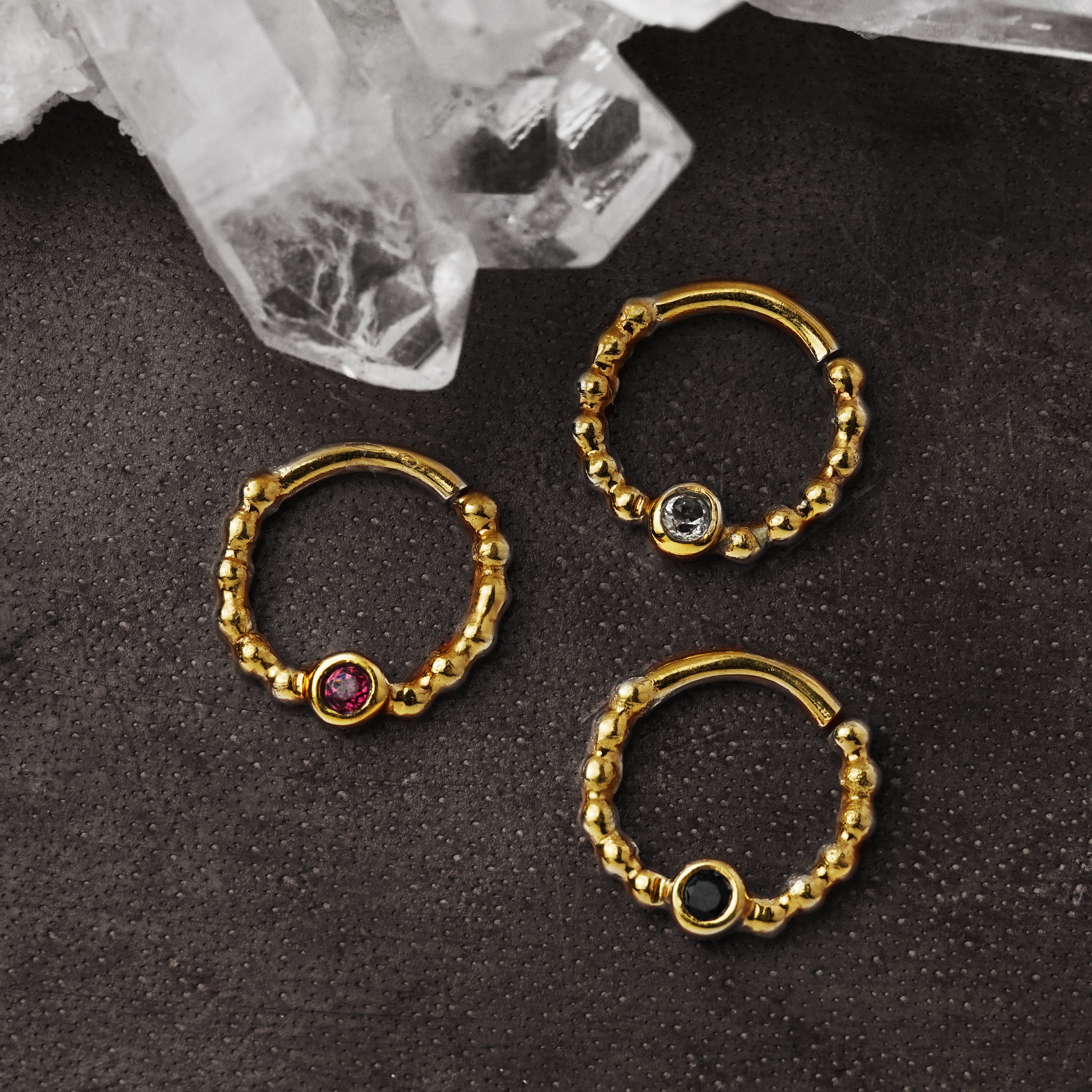 gold dotted septum ring with Black Spinal, Ruby & Topaz gemstones right side view