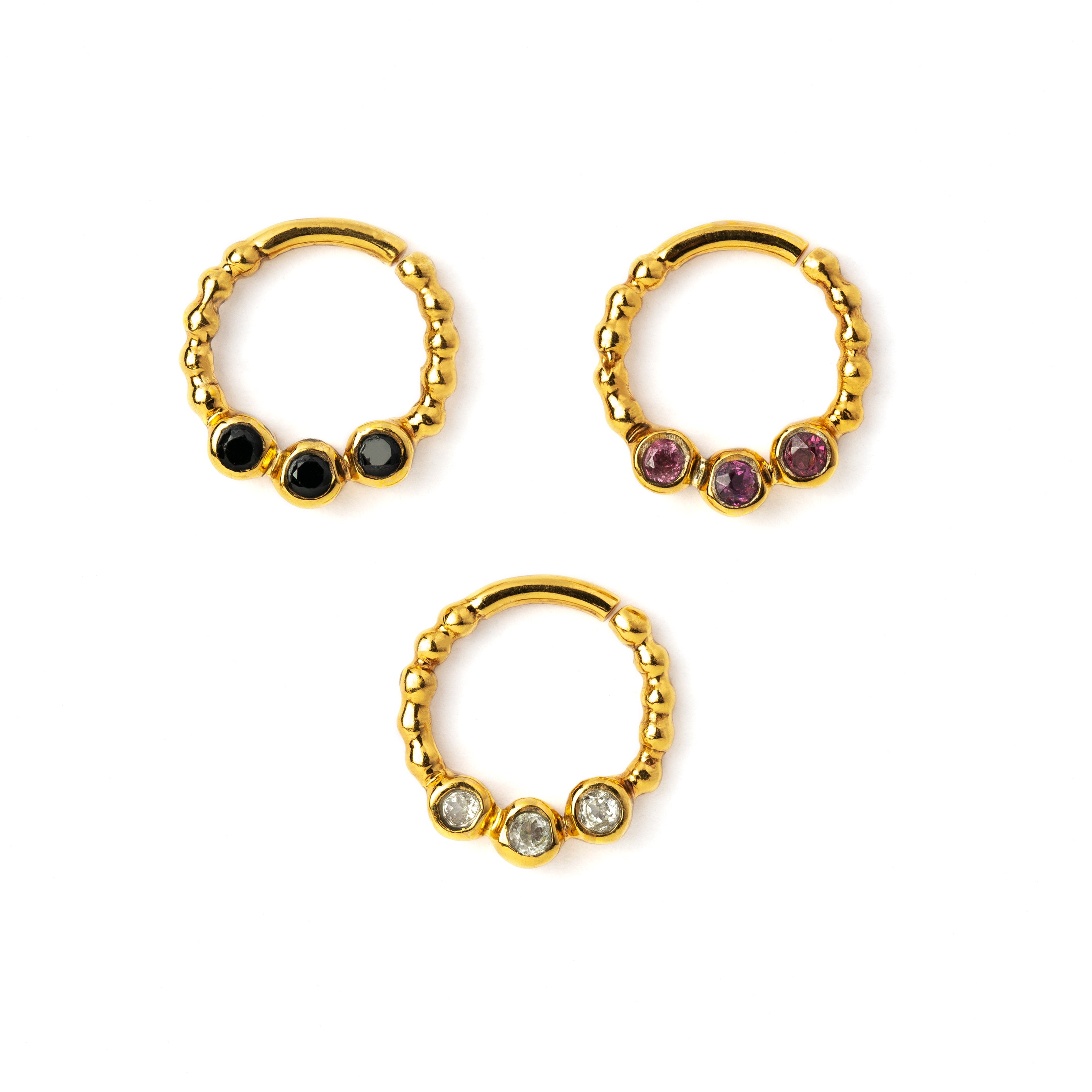 gold dotted septum ring with three Black Spinal, Ruby & Topaz gemstones right side view