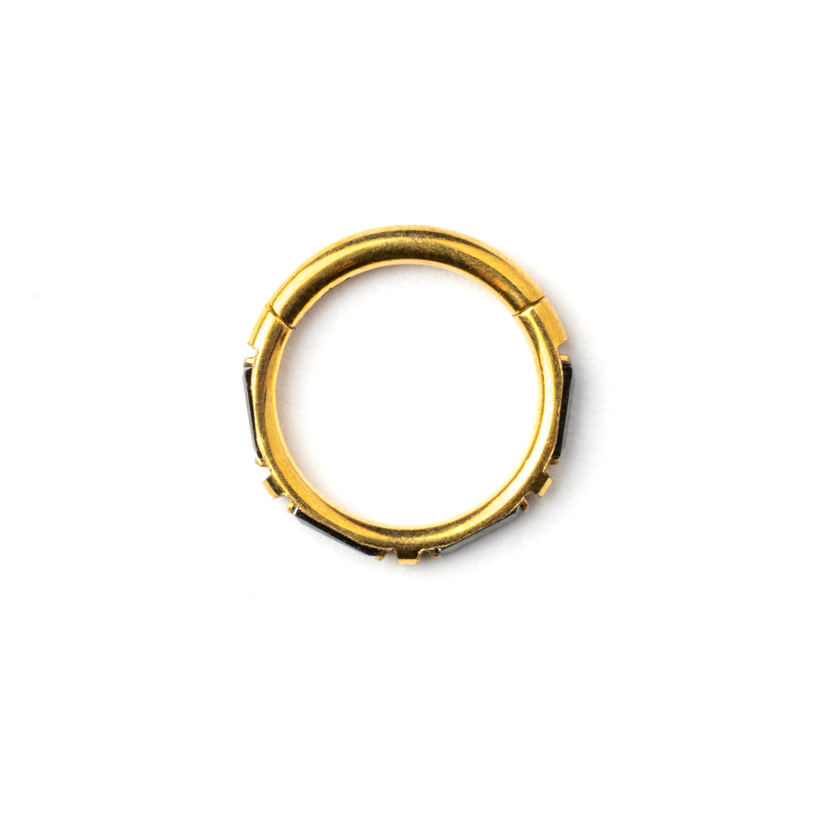 Gold septum clicker with black onyx stones around its rim side view