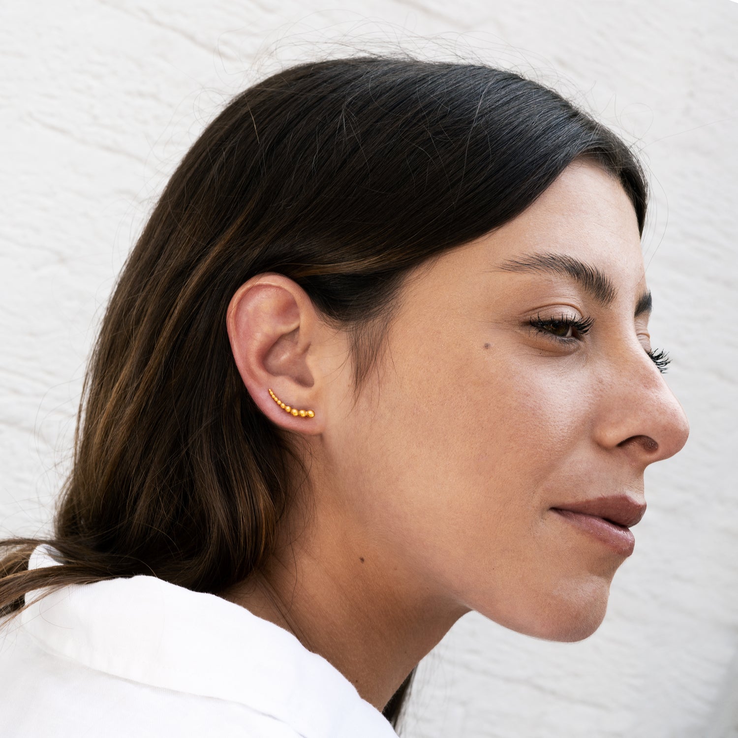 model wearing 24k gold plated silver multiple spheres ear climber1