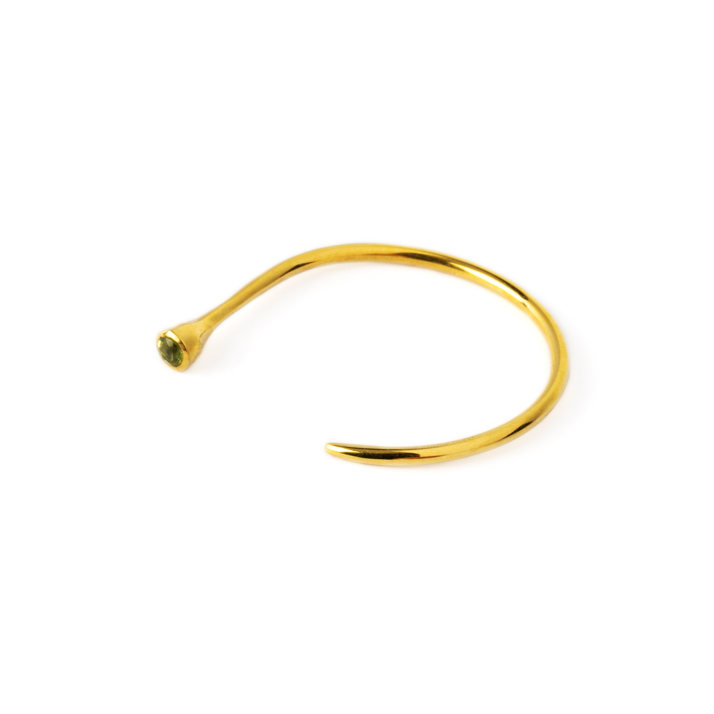 single Gold Tawhio & Emerald earring side close up view