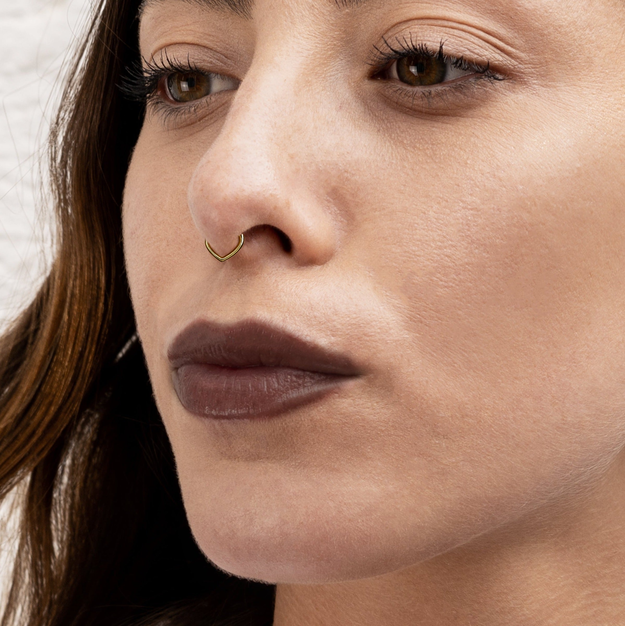 model wearing Gold Teardrop Septum Clicker