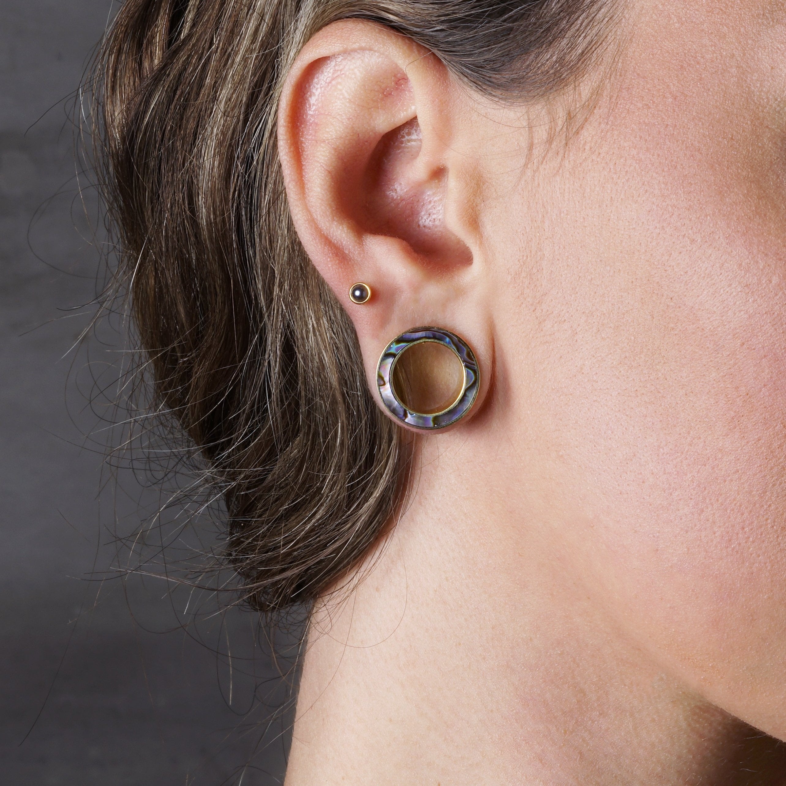model wearing Golden Abalone Tunnels