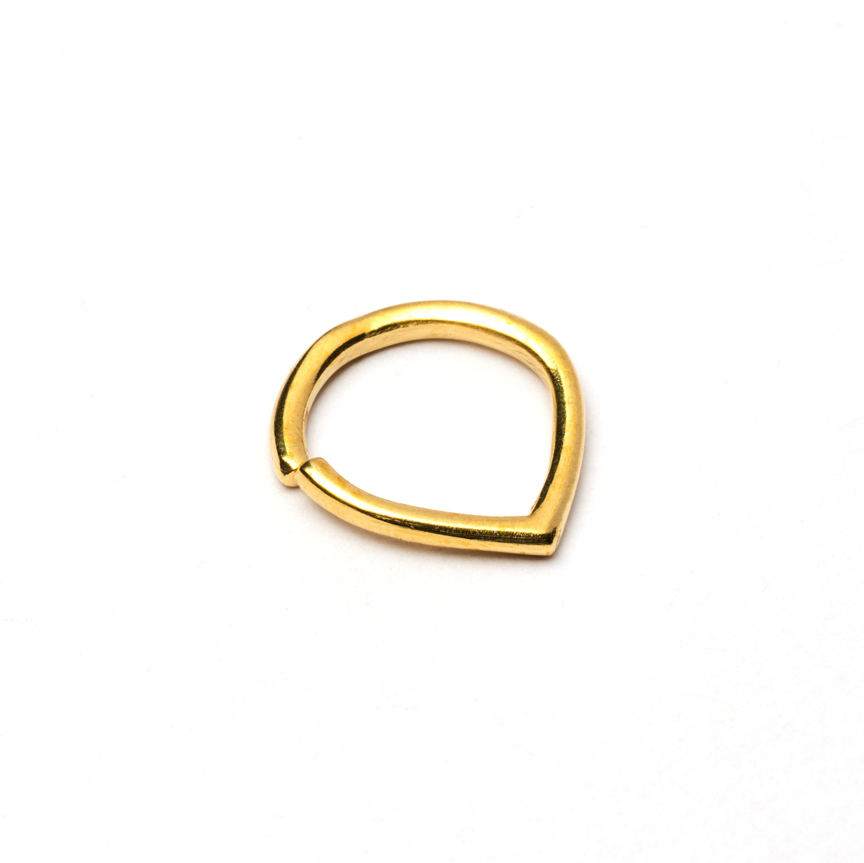 Golden teardrop septum ring left side view