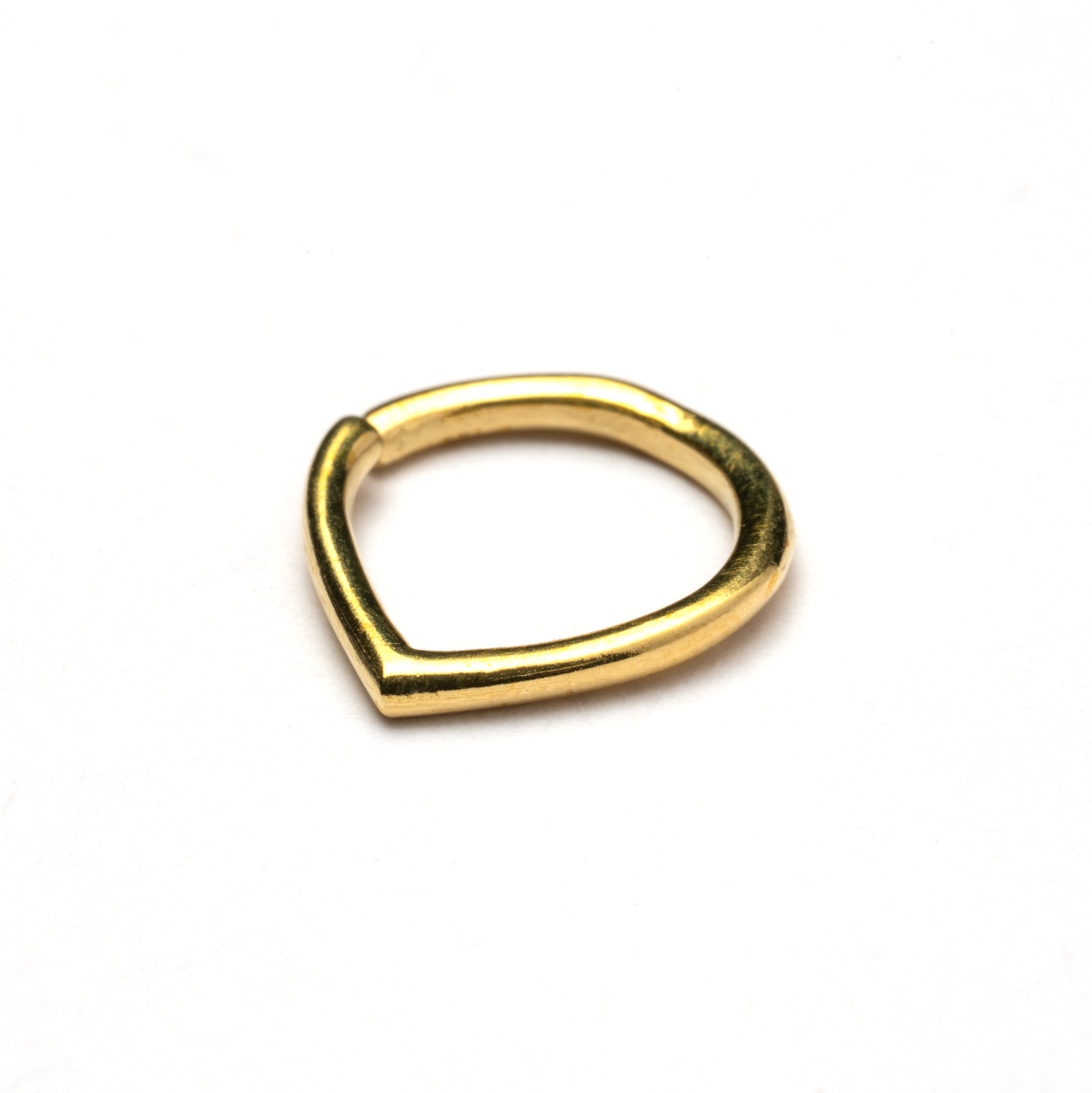 Golden teardrop septum ring right side view