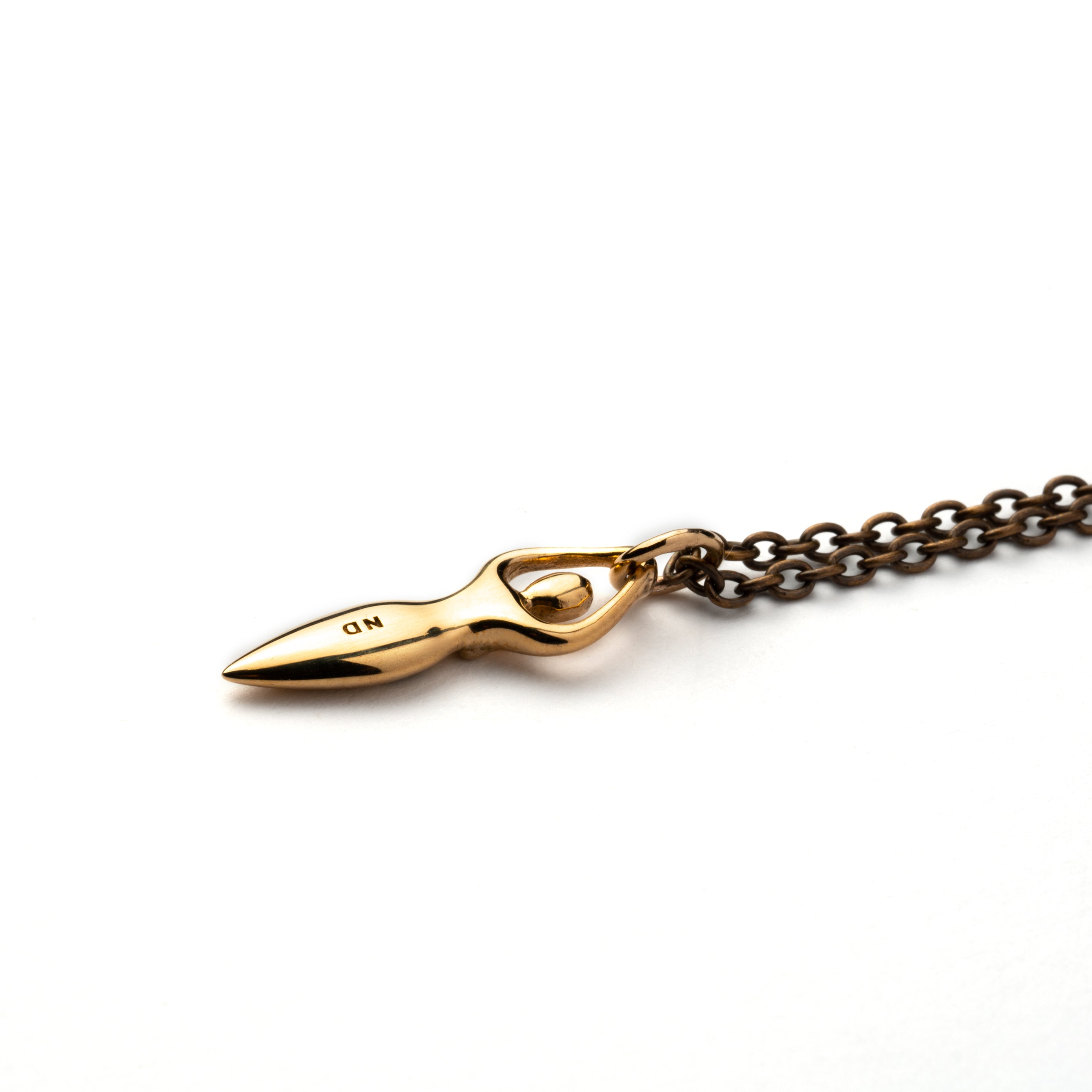 Tiny bronze Fertility goddess with etched spiral charm on a necklace back view view