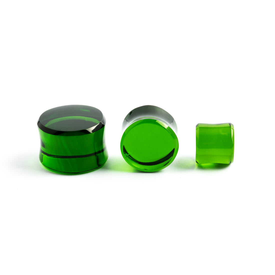 several sizes of Green Obsidian stone double flare ear plugs in different angles