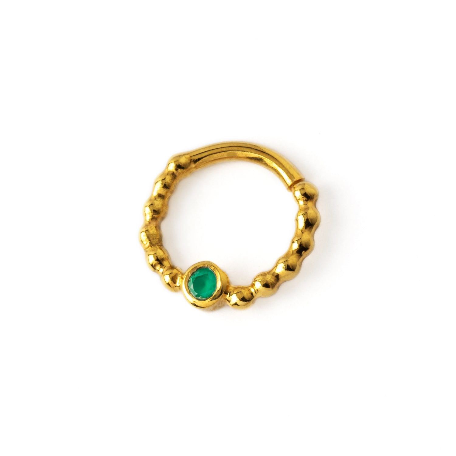 gold dotted septum ring with Emerald gemstone left side view