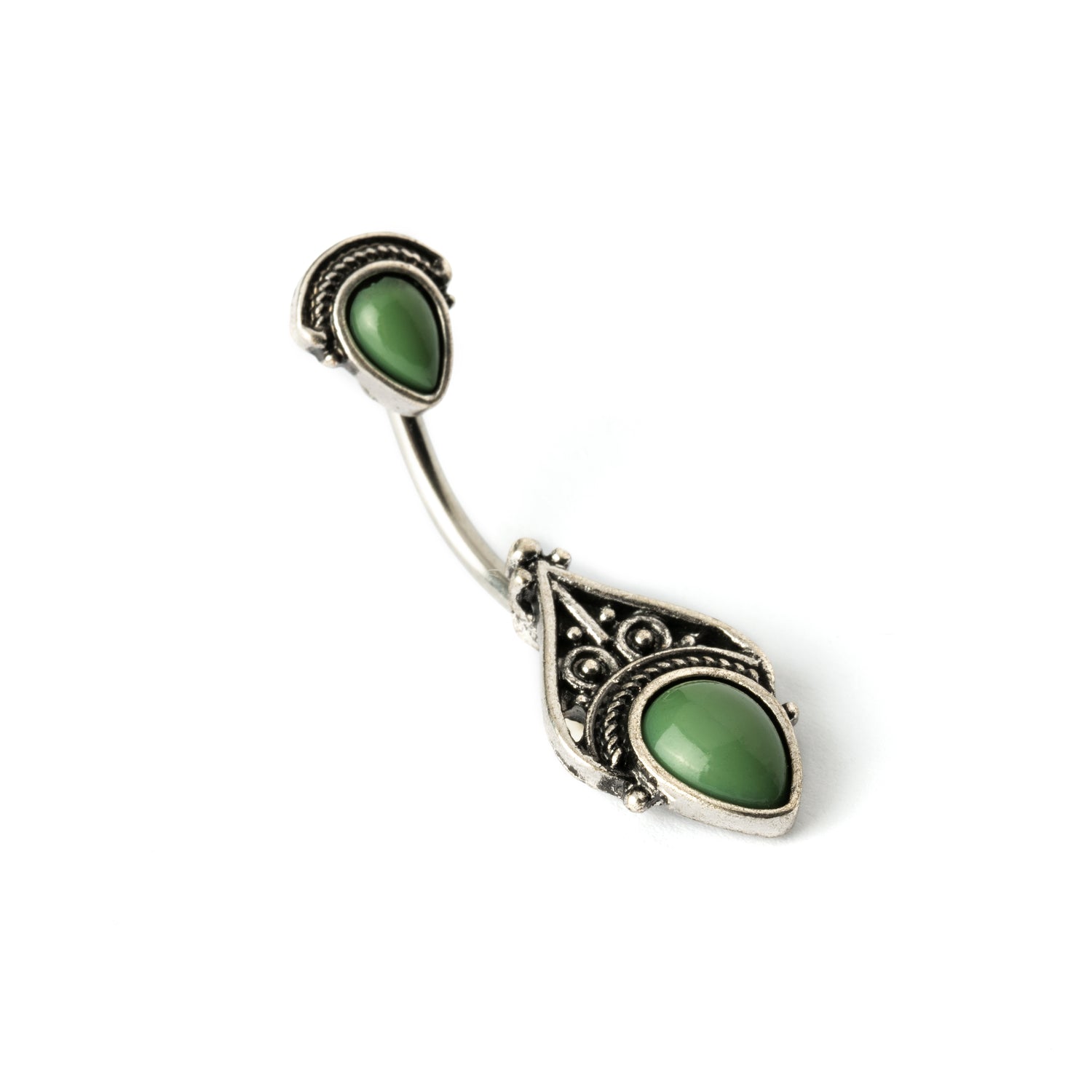 navel bar with silver toned goth ornament with two green stones one at the top and one at the bottom right side view