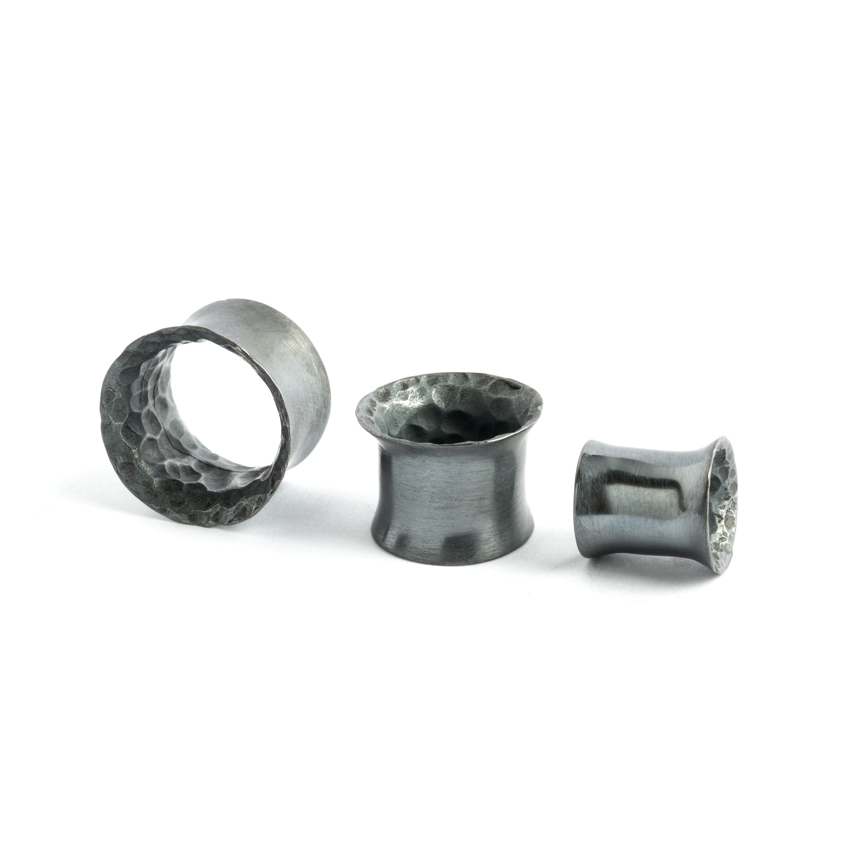 different sizes of Hammered Black Silver Ear Tunnels side view