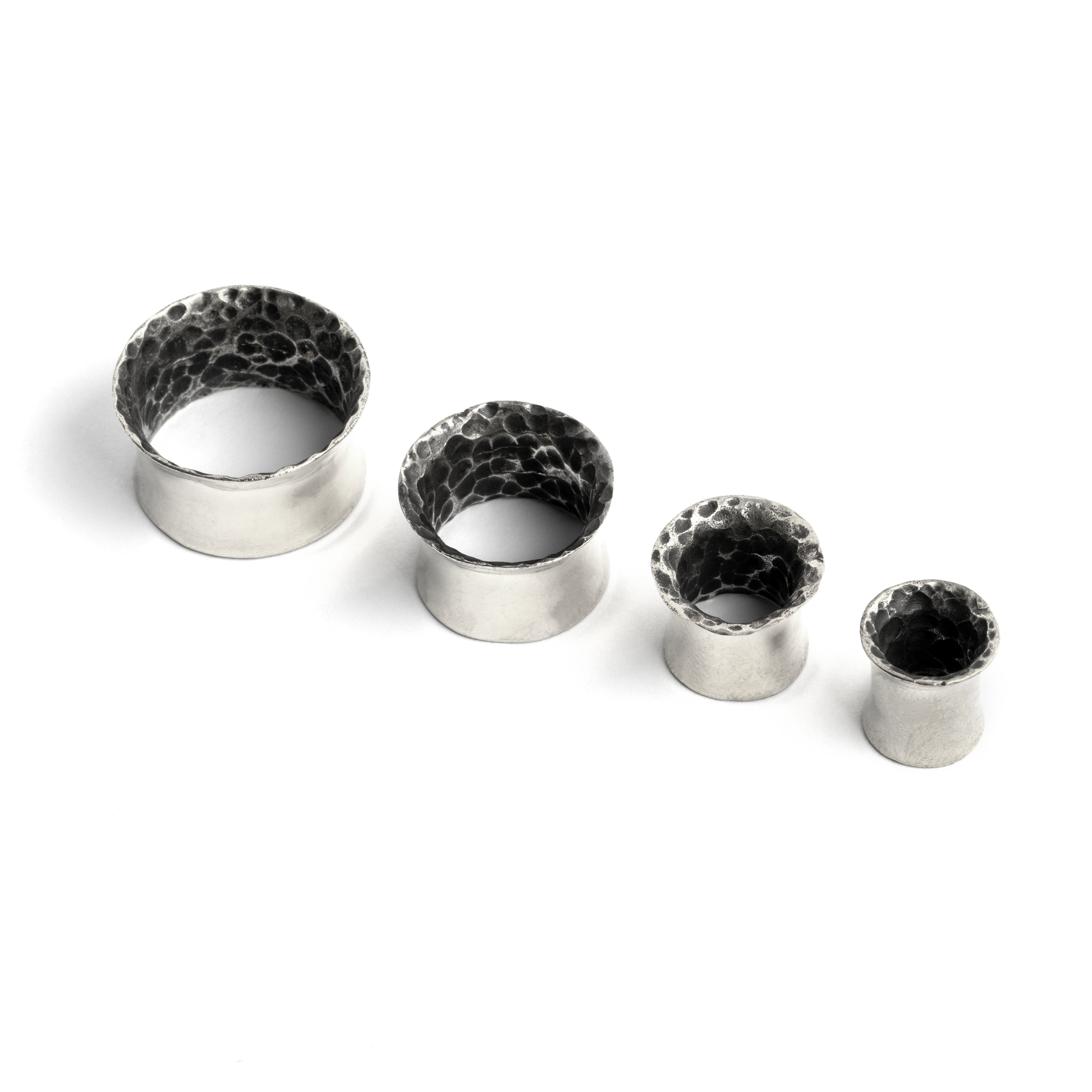 different sizes of Hammered Silver ear tunnels frontal view