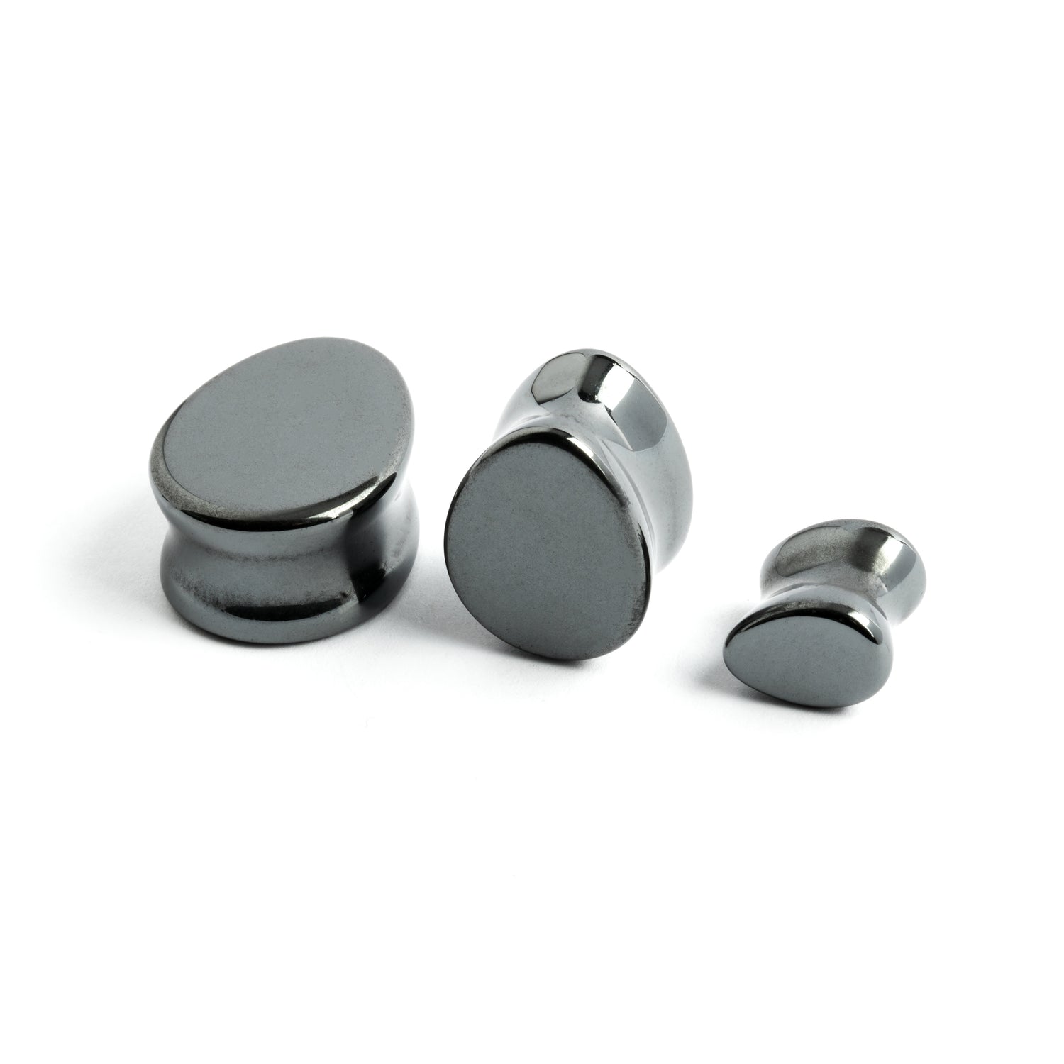 several sizes of  hematite stone teardrop shaped ear plugs