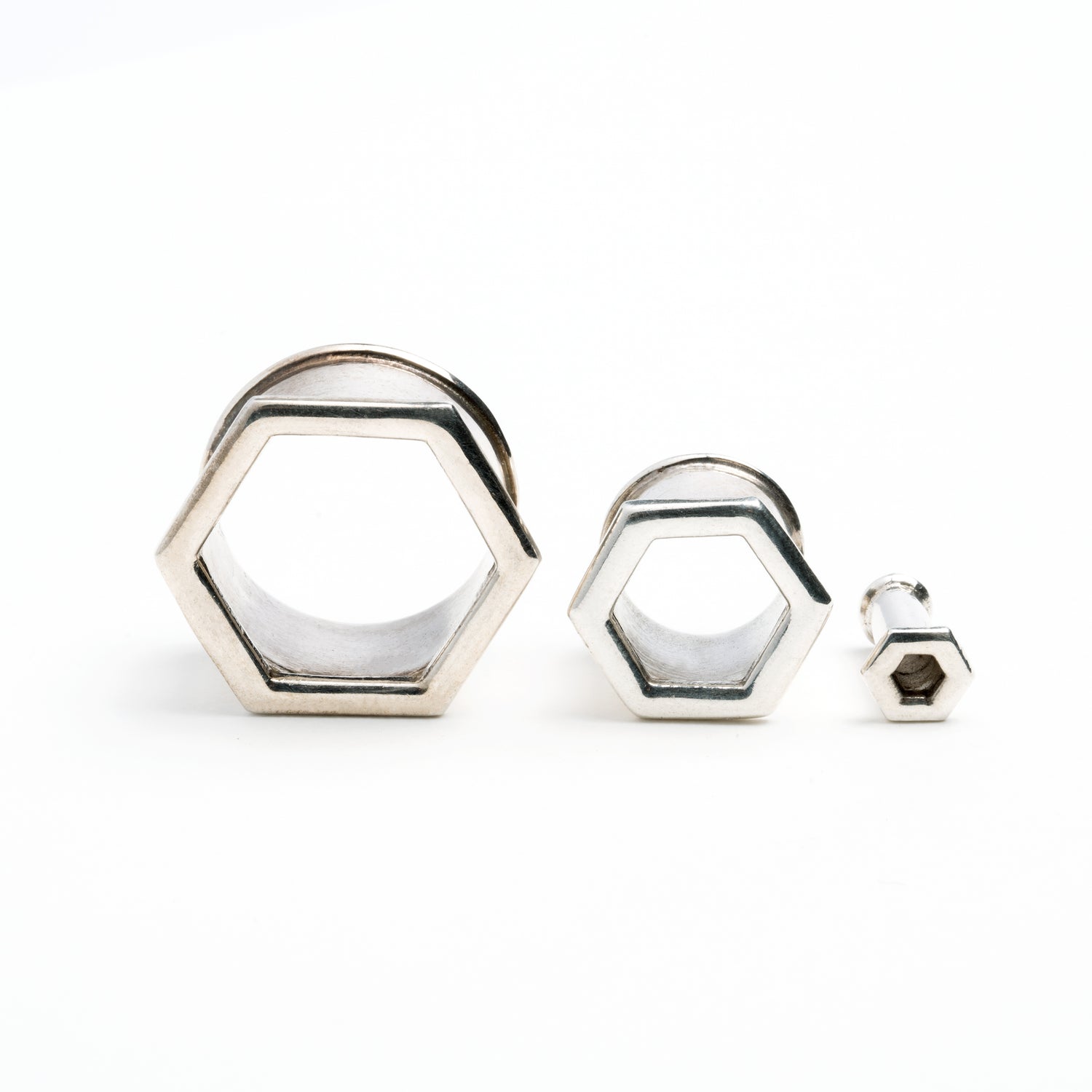 several sizes of hexagon ear tunnels front view