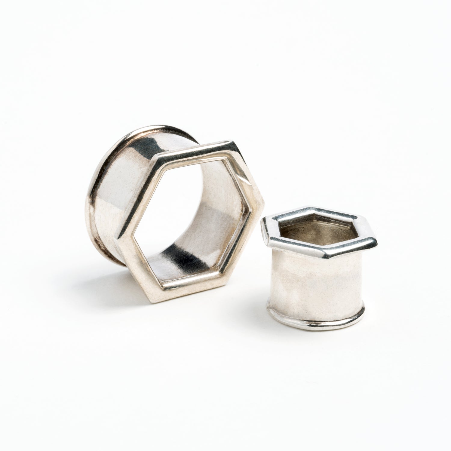 two sizes of hexagon ear tunnels front and side view