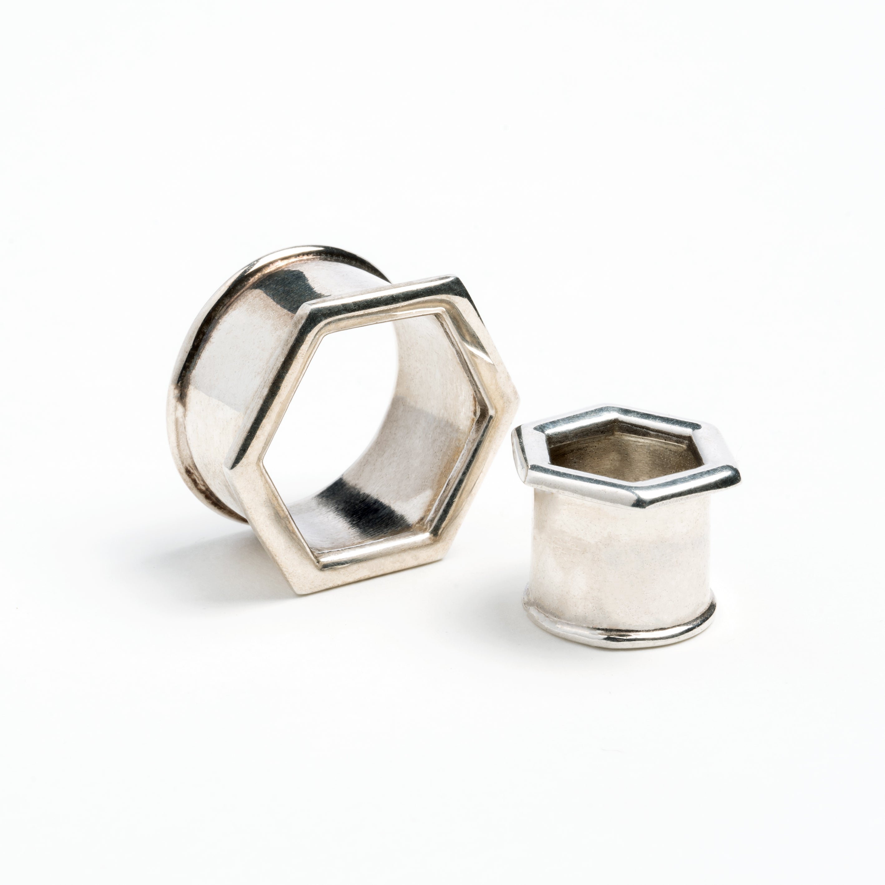 two sizes of hexagon ear tunnels front and side view
