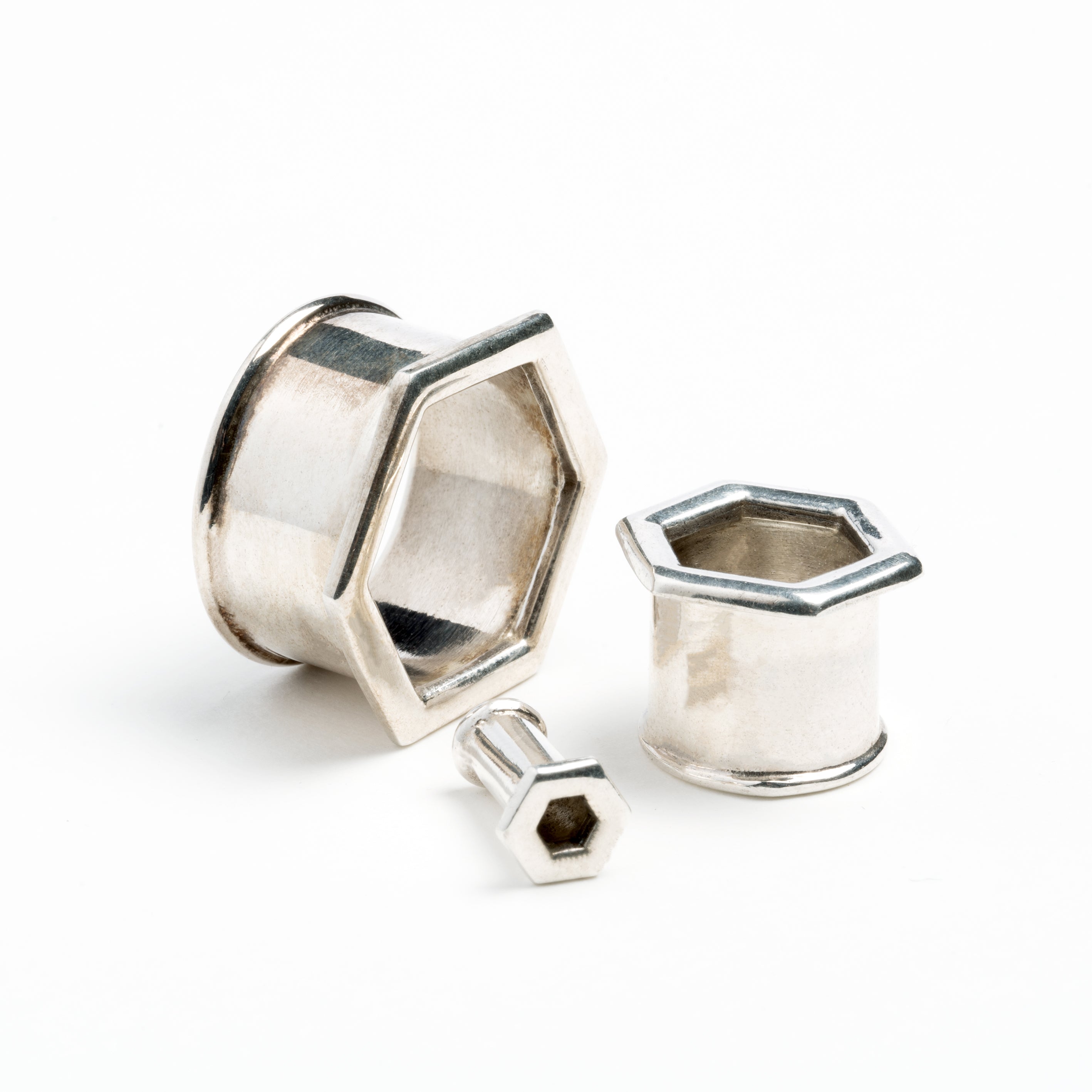 several sizes of hexagon ear tunnels all sides view