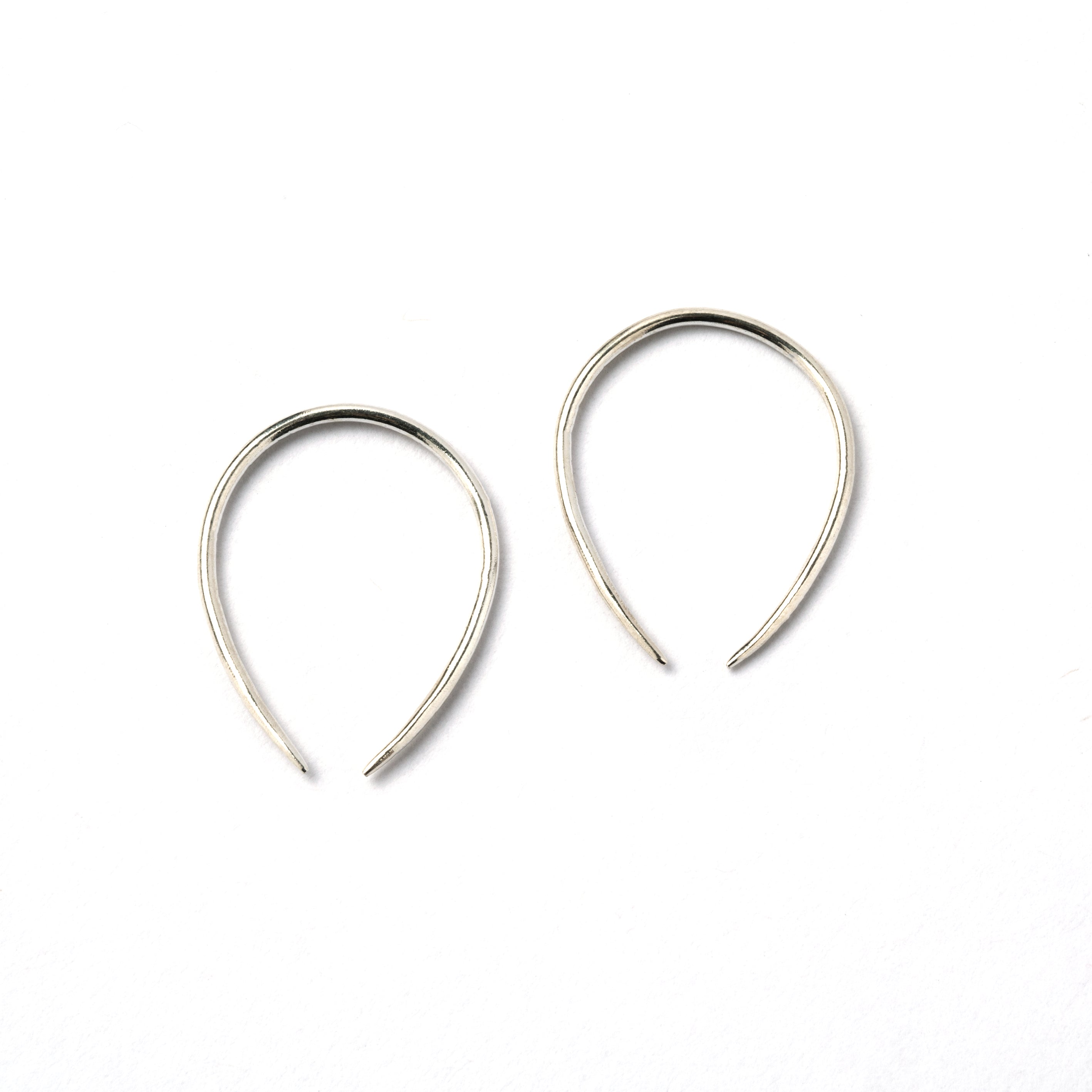 pair of 1mm silver wire horseshoe earrings side view