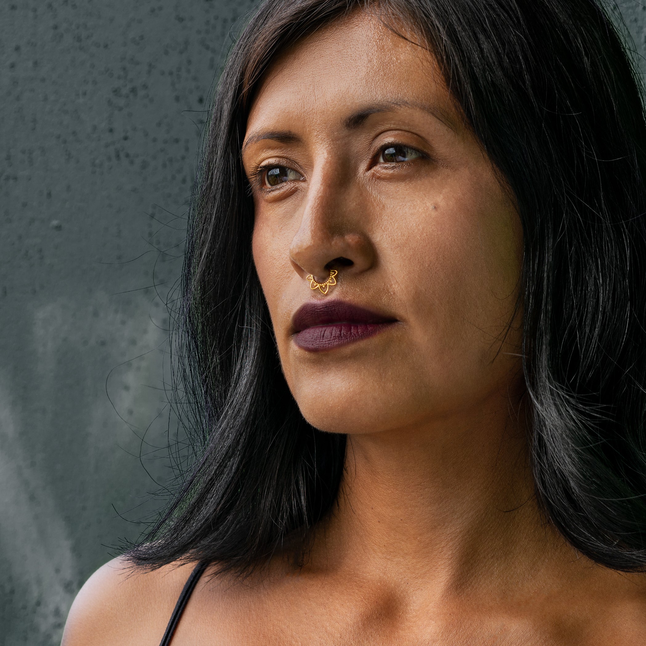 model wearing 1.2mm (16g), 8mm surgical steel lotus flower septum clicker frontal view