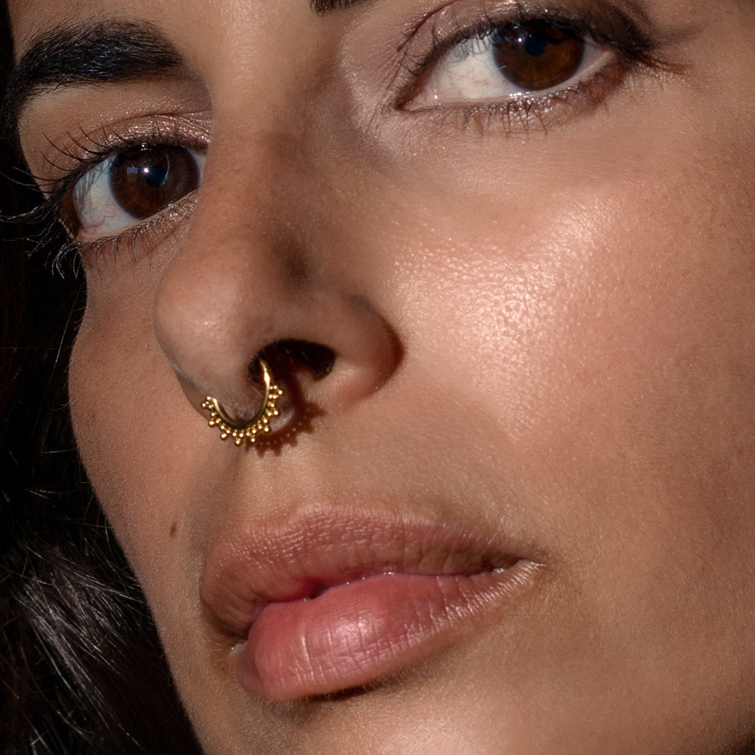 model wearing Sarika Golden Septum Clicker