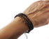 small size three Lava & Tiger Eye beads bracelets on a woman wrist