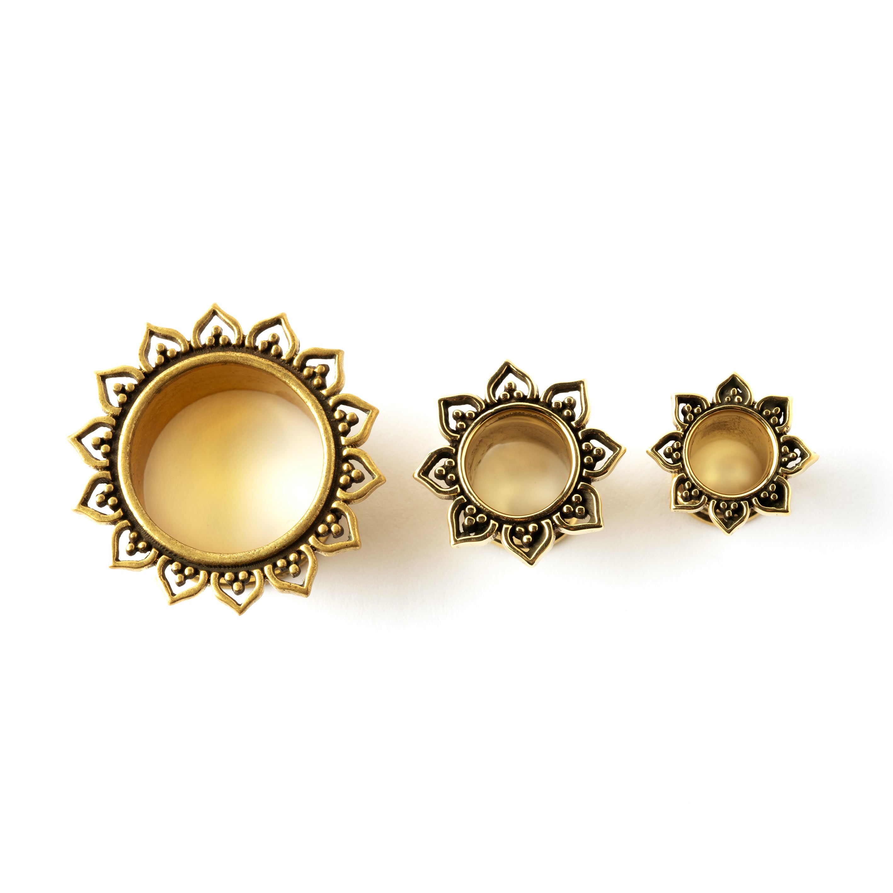 several sizes of Iriya golden lotus petals plug tunnels front side view