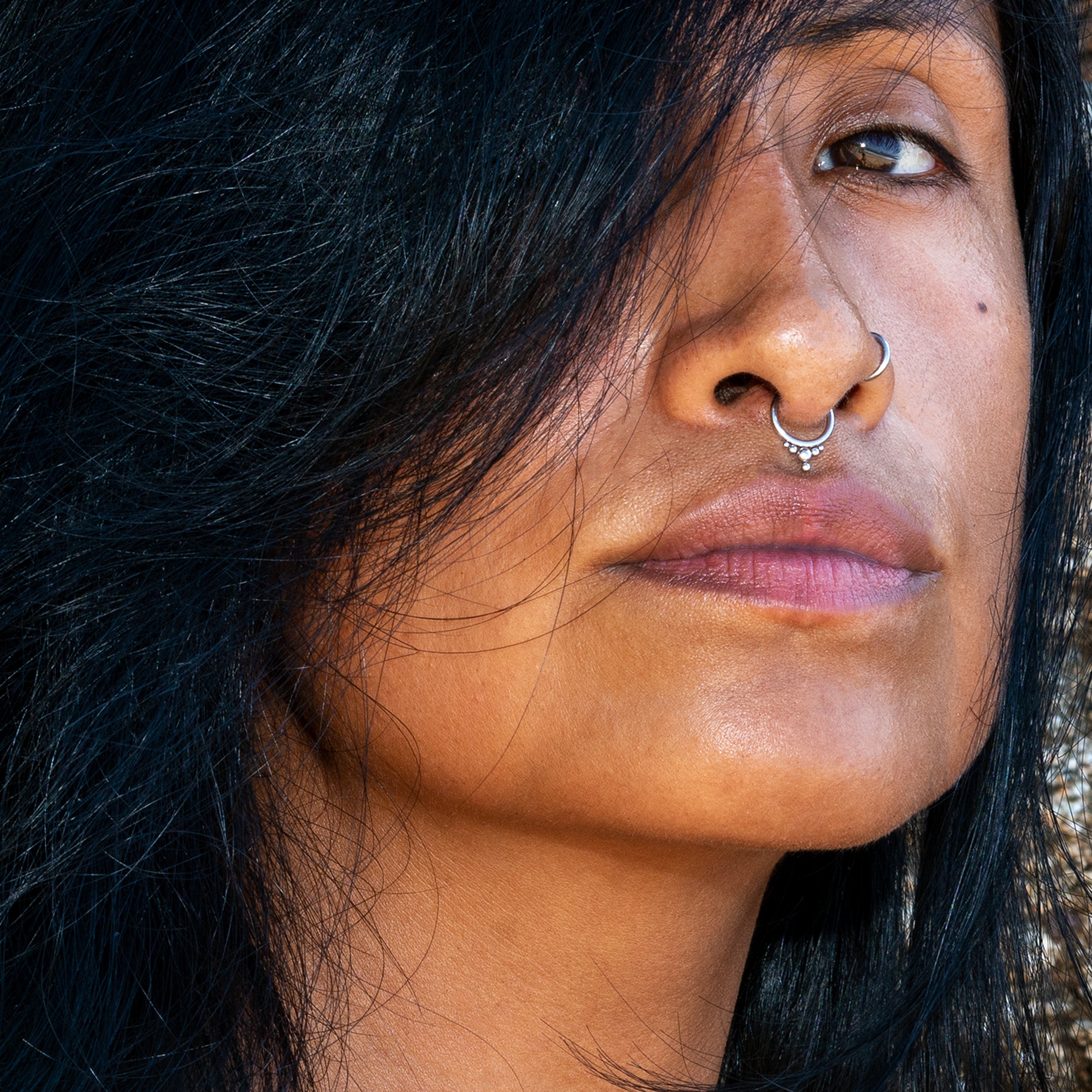 model wearing surgical steel Malee septum clicker