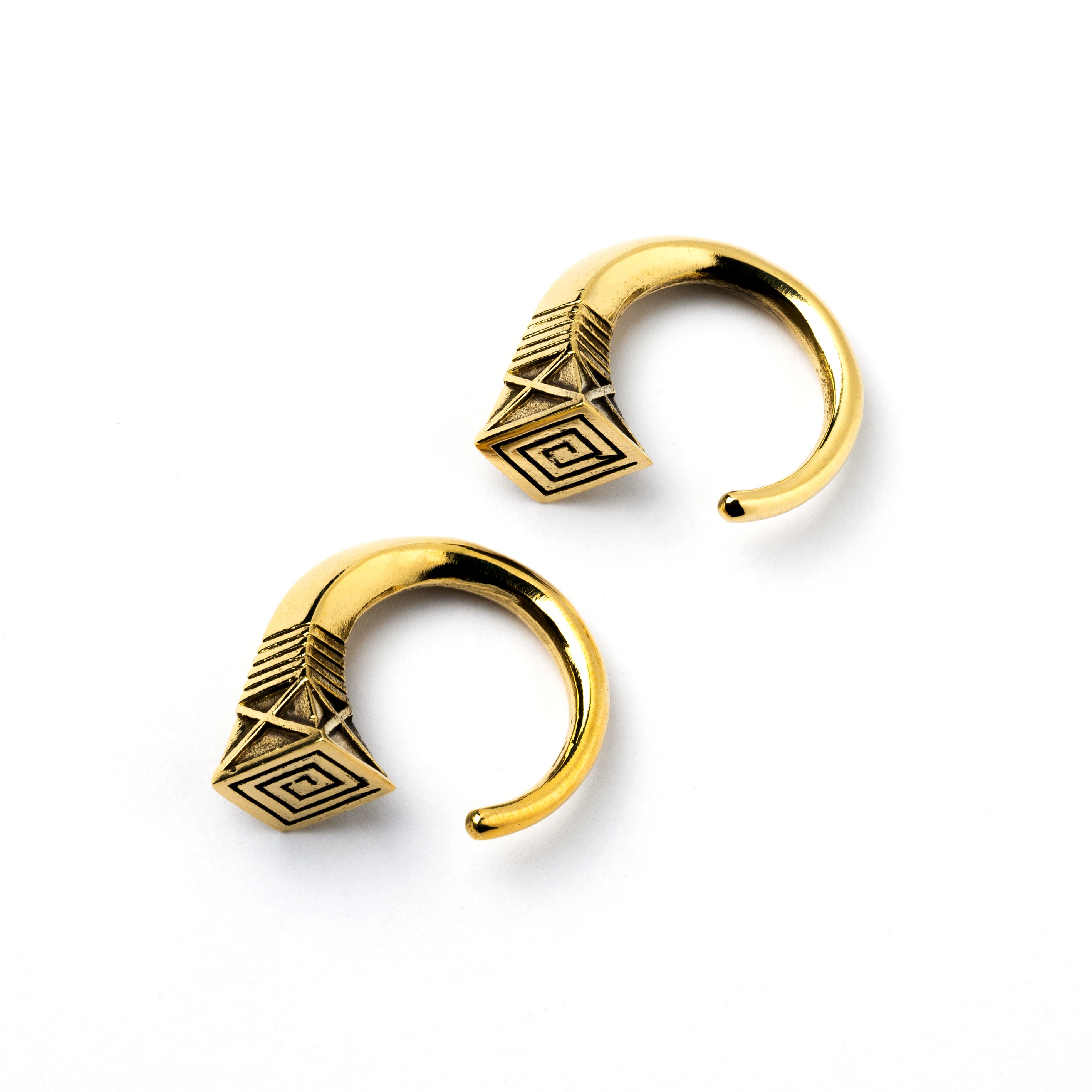 pair of gold brass hook weights hangers with geometric design left side view