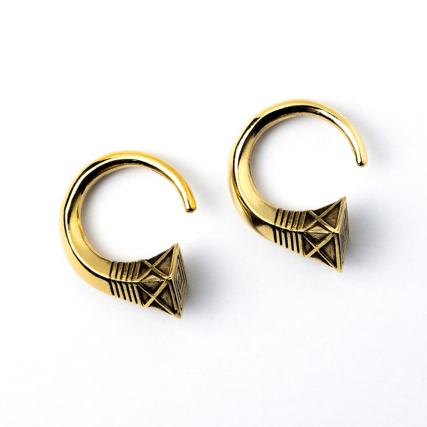 pair of gold brass hook weights hangers with geometric design frontal view