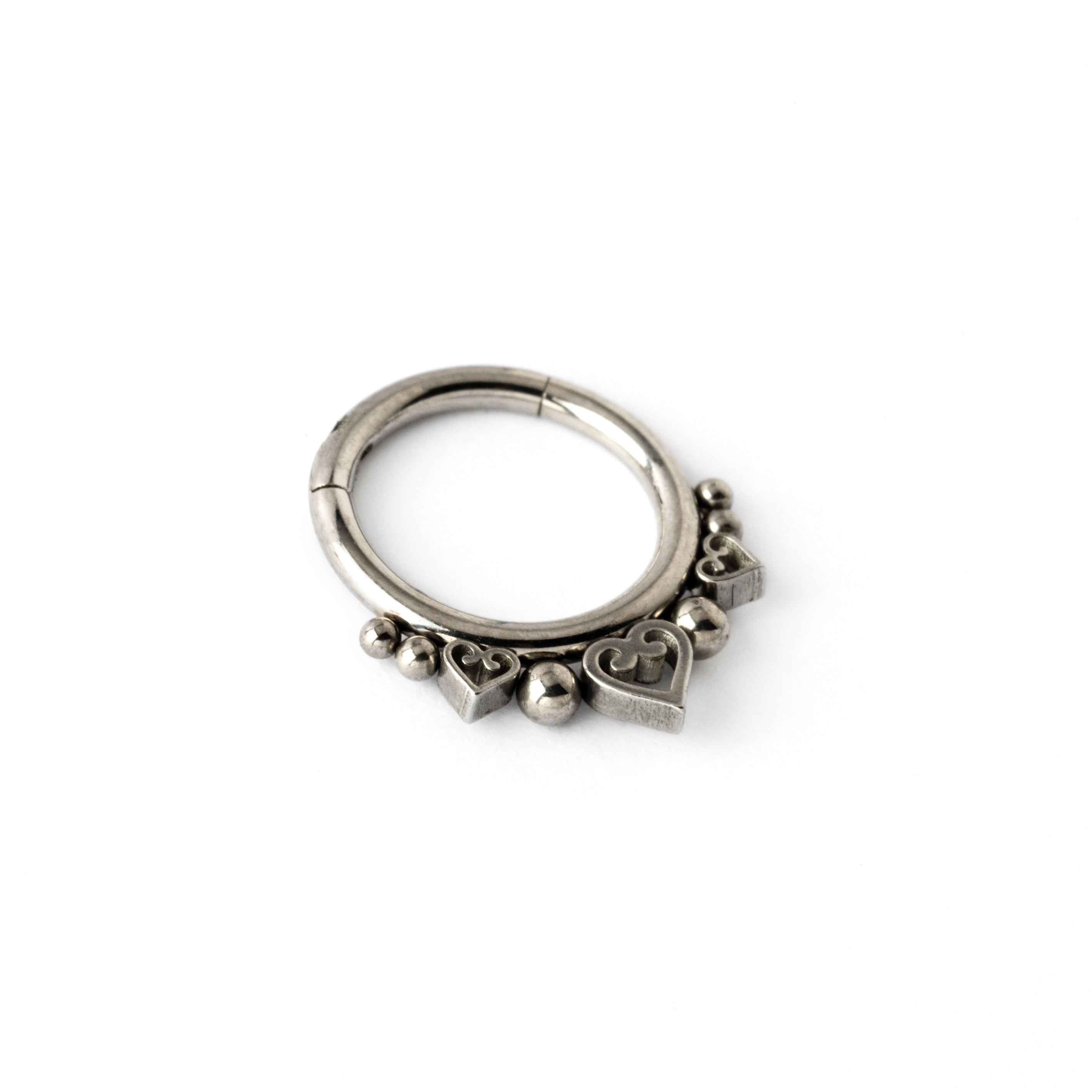 surgical steel hinged segment ring with spheres and hearts ornaments side view
