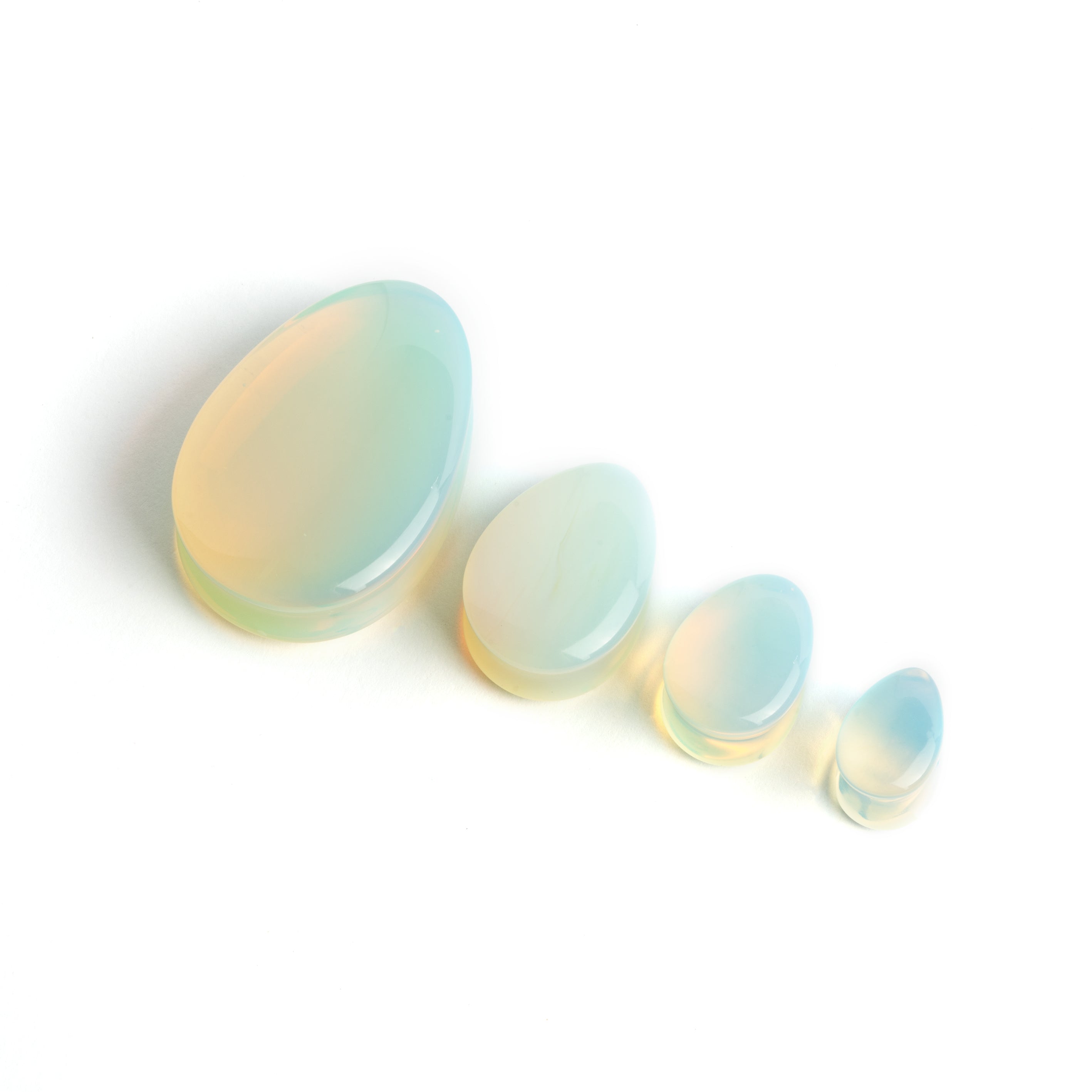 severy sizes of Opalite teardrop ear plugs frontal view