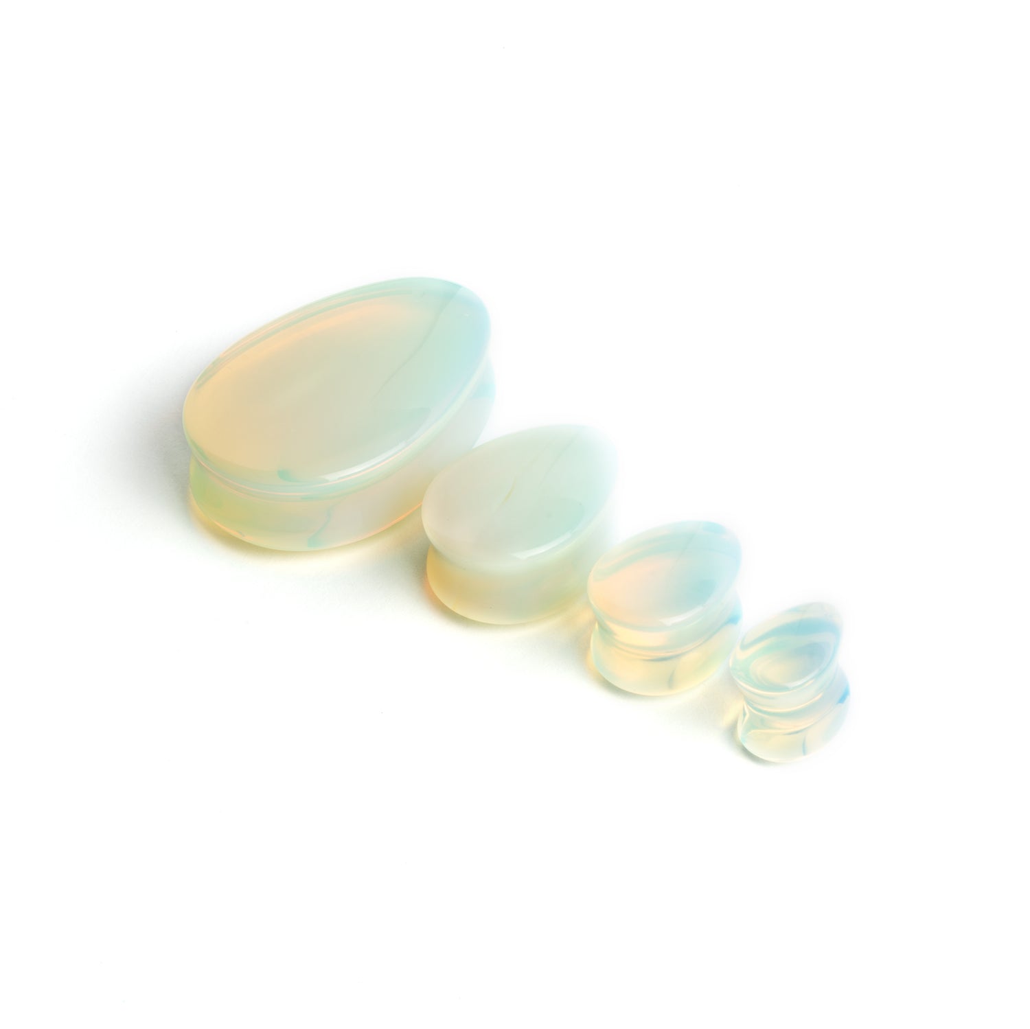 severy sizes of Opalite teardrop ear plugs side view