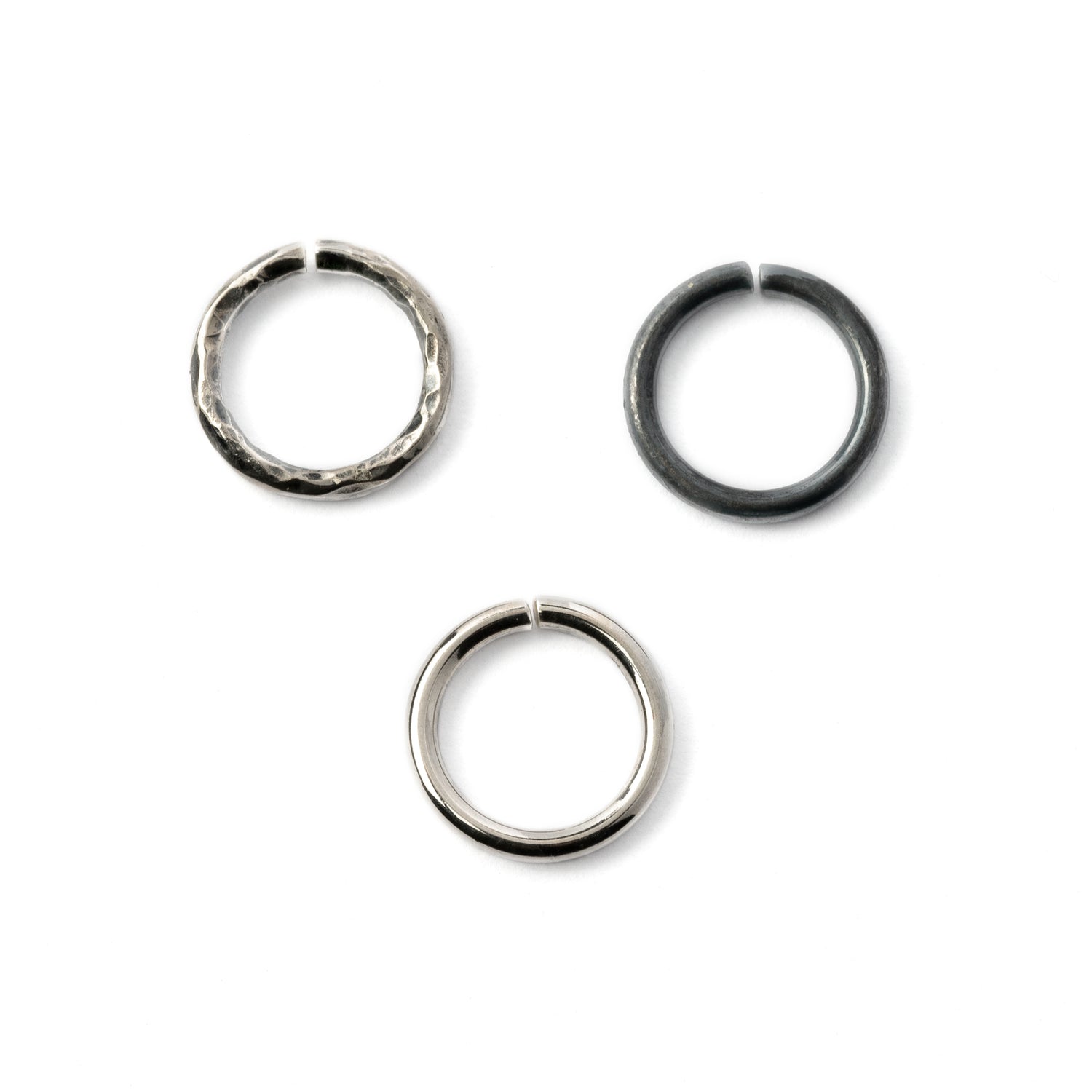 Plain silver, black hammered seamless piercing rings