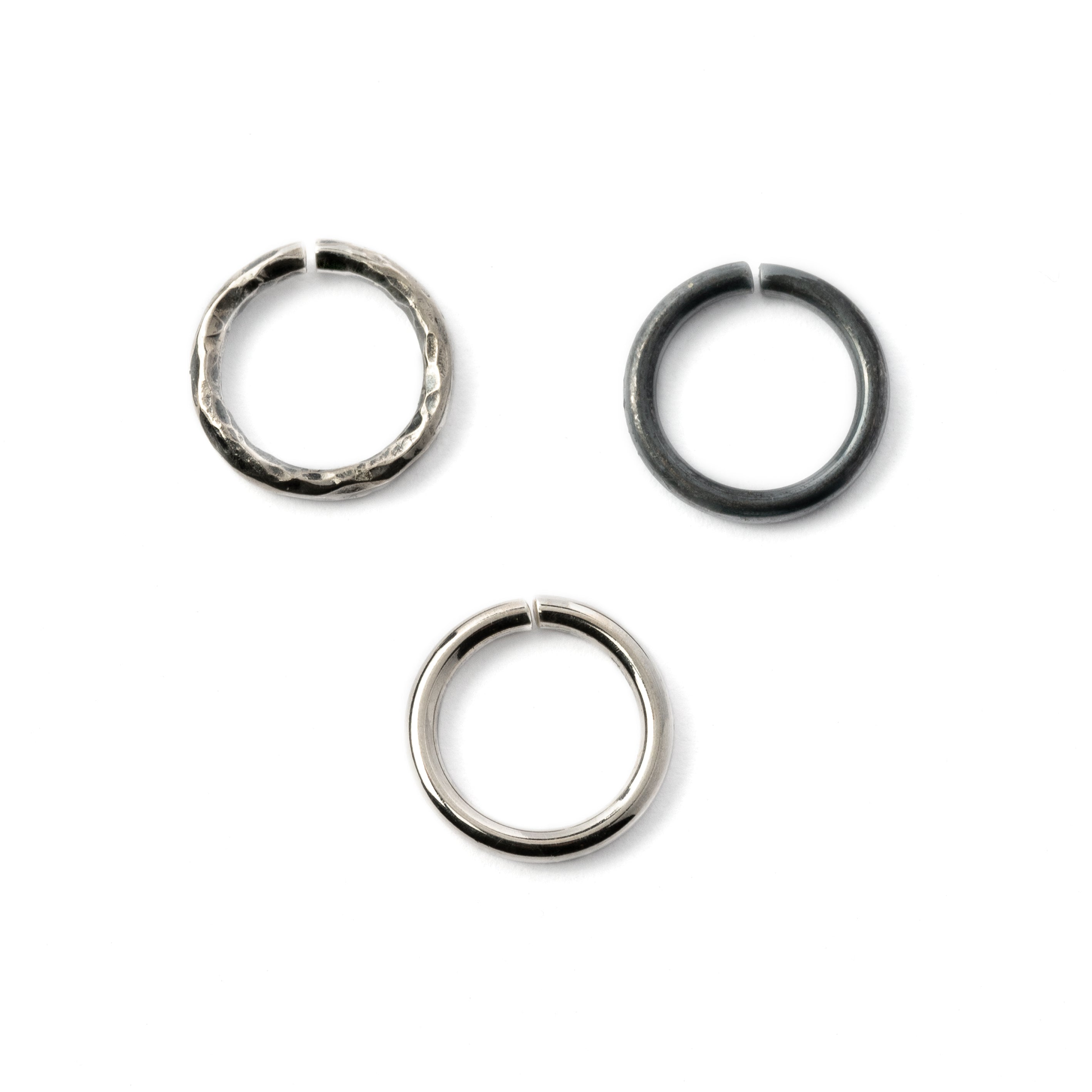 Plain silver, black hammered seamless piercing rings