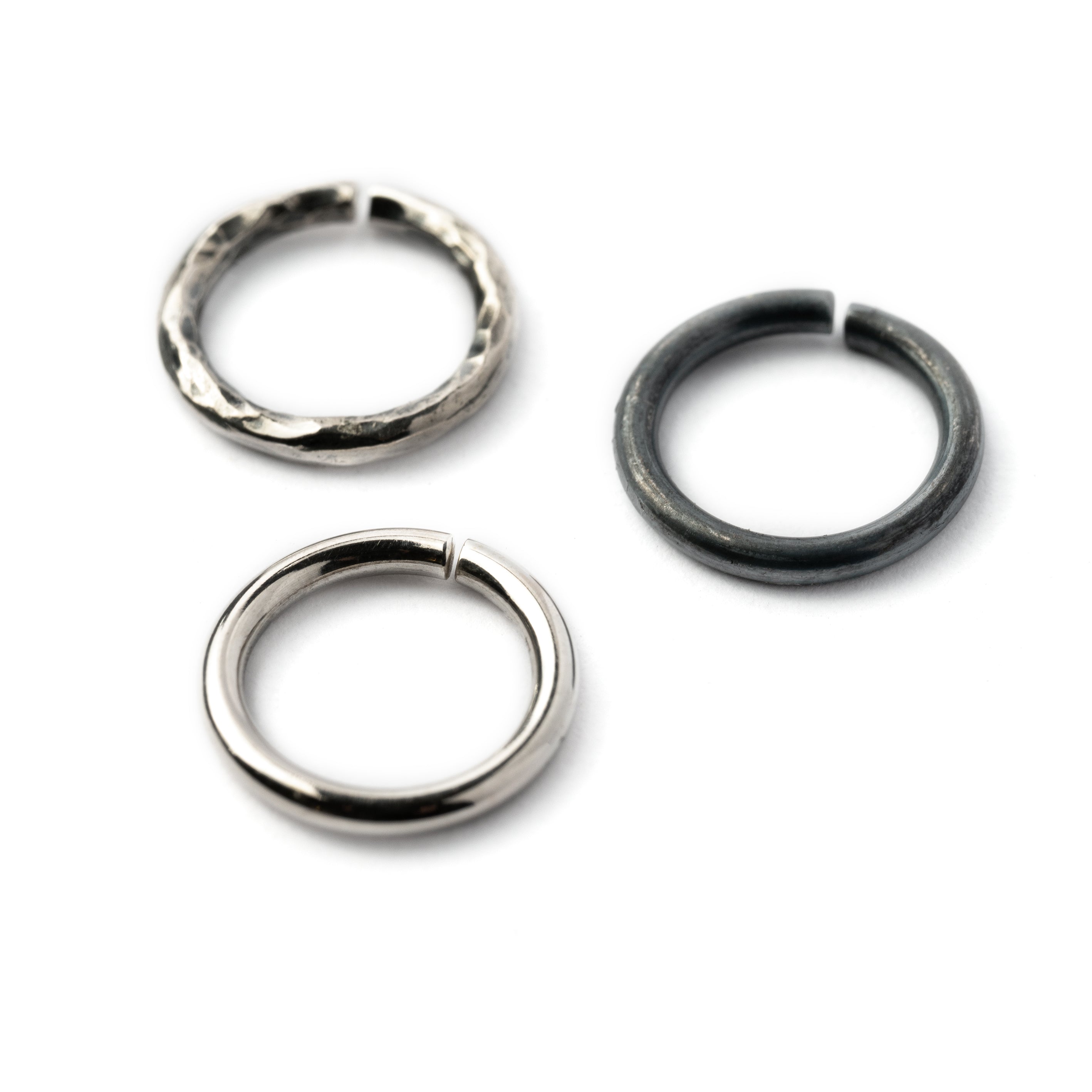 Plain silver, black hammered seamless piercing rings