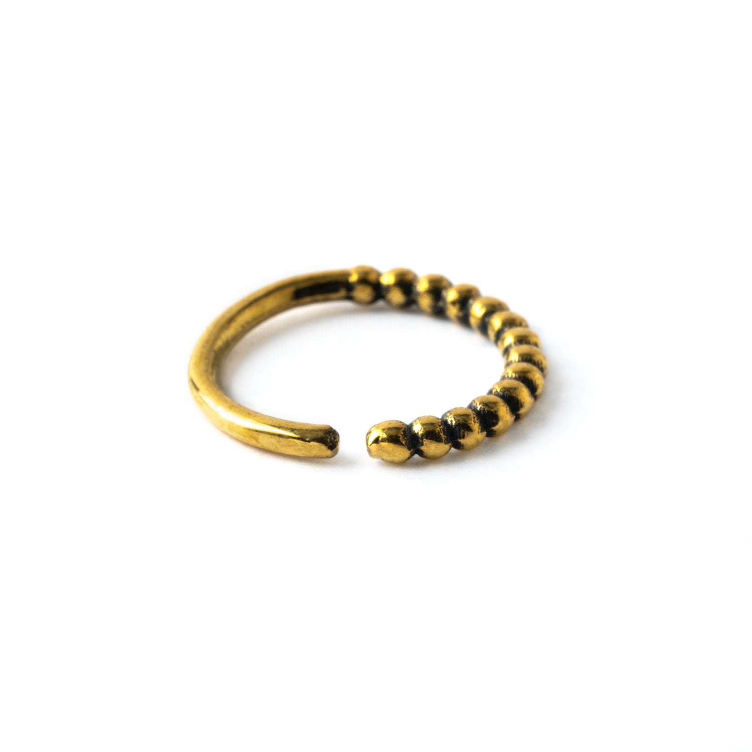 Ravi golden brass septum ring side view
