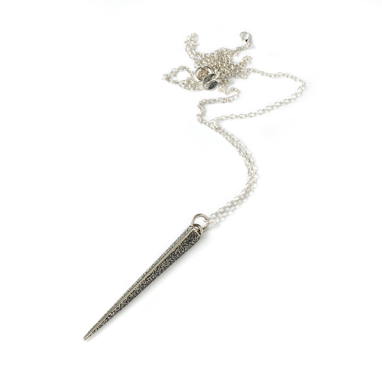 textured silver ridged spike pendant on a chain