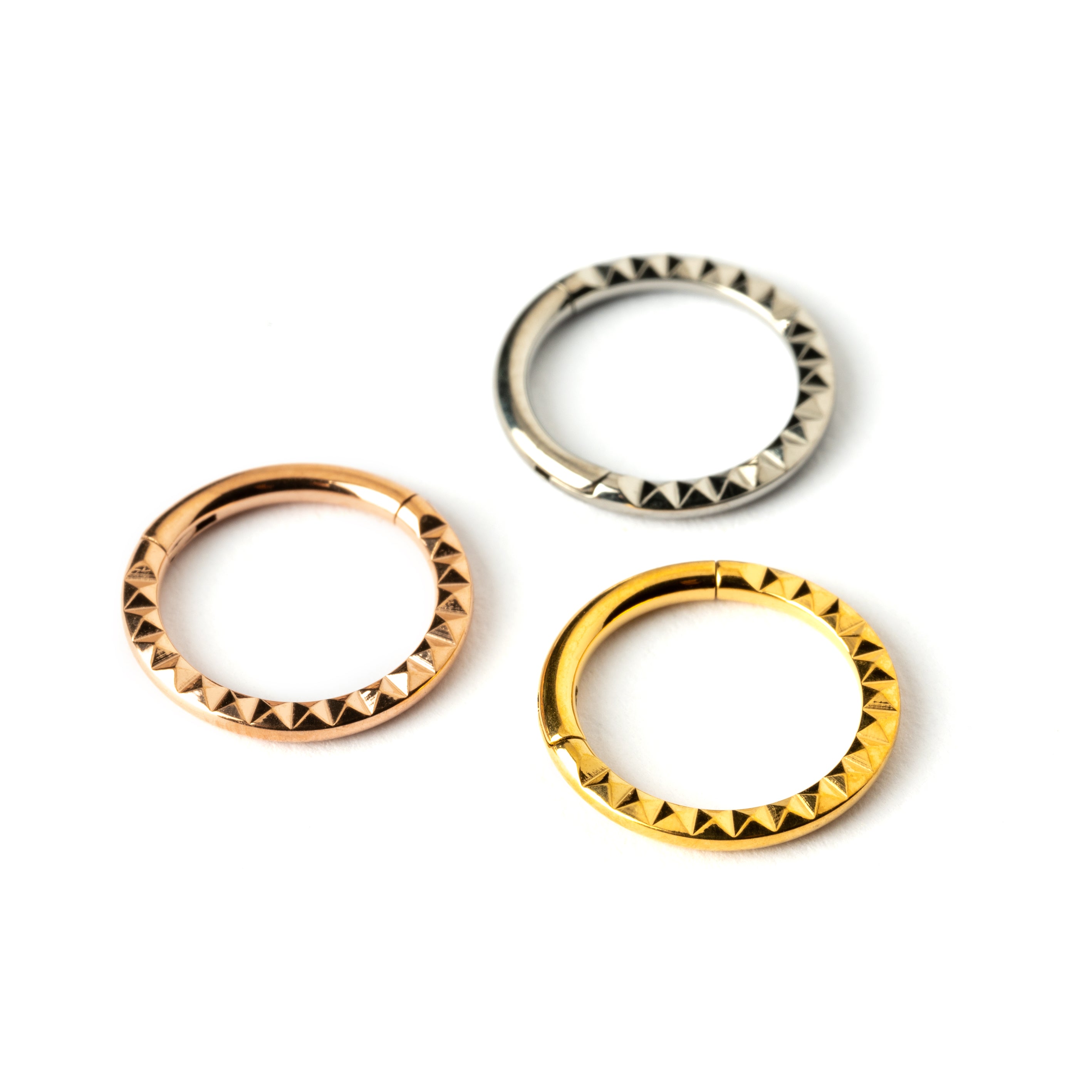 Giza gold, rose gold surgical steel clicker ring with 3d pyramid patter side view